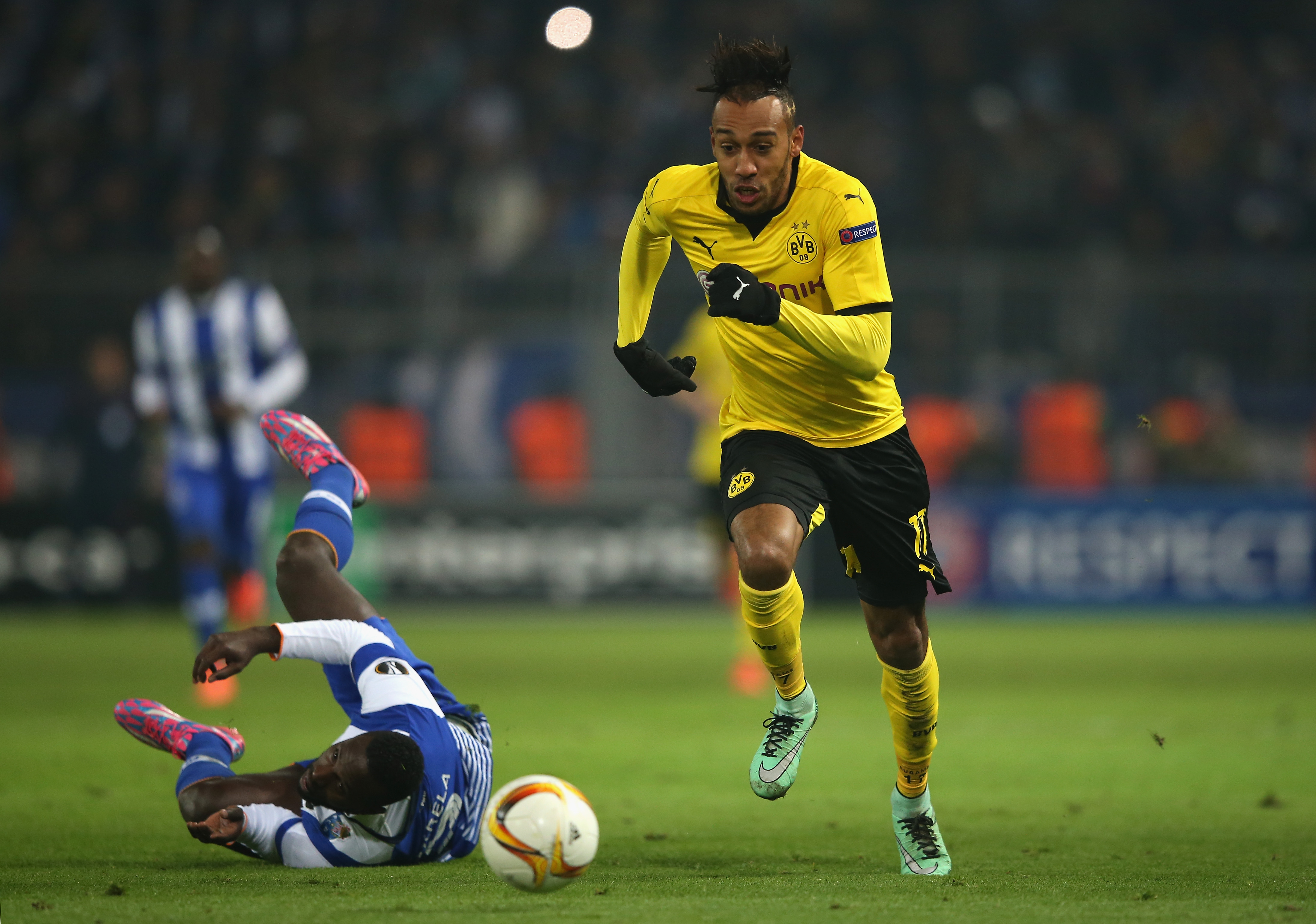 DORTMUND, GERMANY - FEBRUARY 18: Pierre-Emerick Aubameyang of Borussia Dortmund runs past Silvestre Varela of FC Porto during the UEFA Europa League round of 32 first leg match between Borussia Dortmund and FC Porto at Signal Iduna Park on February 18, 2016 in Dortmund, Germany. (Photo by Lars Baron/Bongarts/Getty Images)