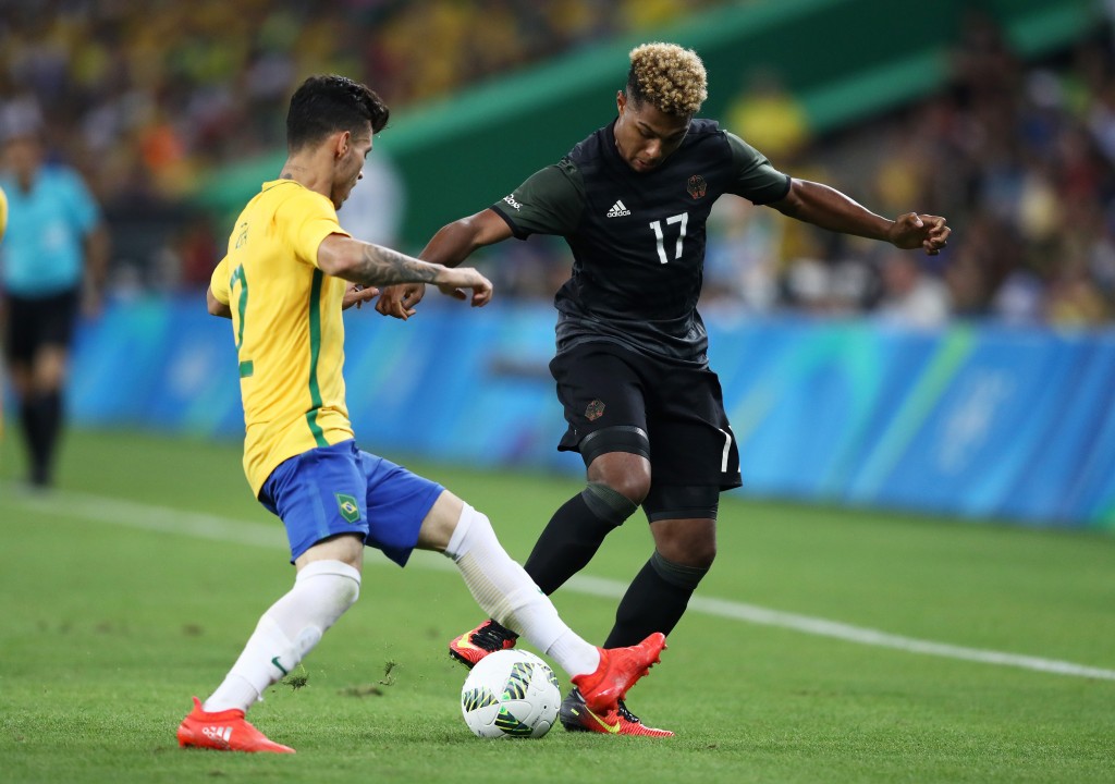 RIO DE JANEIRO, BRAZIL - AUGUST 20: Serge Gnabry of Germany and Zeca of Brazil during the Men's Football Final between Brazil and Germany at the Maracana Stadium on Day 15 of the Rio 2016 Olympic Games on August 20, 2016 in Rio de Janeiro, Brazil. (Photo by Clive Mason/Getty Images)