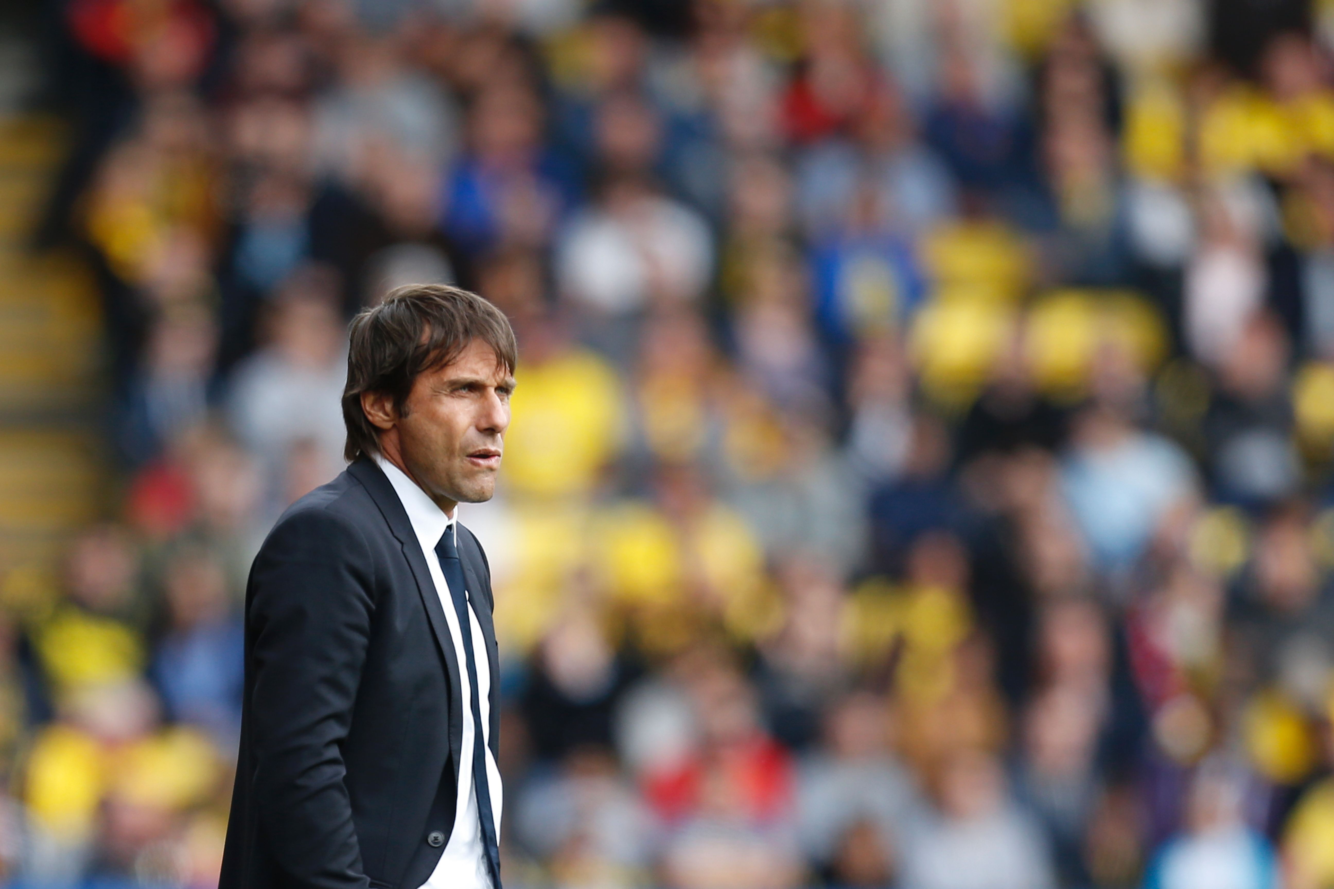 Chelsea's Italian head coach Antonio Conte watches from the touchline during the English Premier League football match between Watford and Chelsea at Vicarage Road Stadium in Watford, north of London on August 20, 2016. / AFP / Ian Kington / RESTRICTED TO EDITORIAL USE. No use with unauthorized audio, video, data, fixture lists, club/league logos or 'live' services. Online in-match use limited to 75 images, no video emulation. No use in betting, games or single club/league/player publications. / (Photo credit should read IAN KINGTON/AFP/Getty Images)