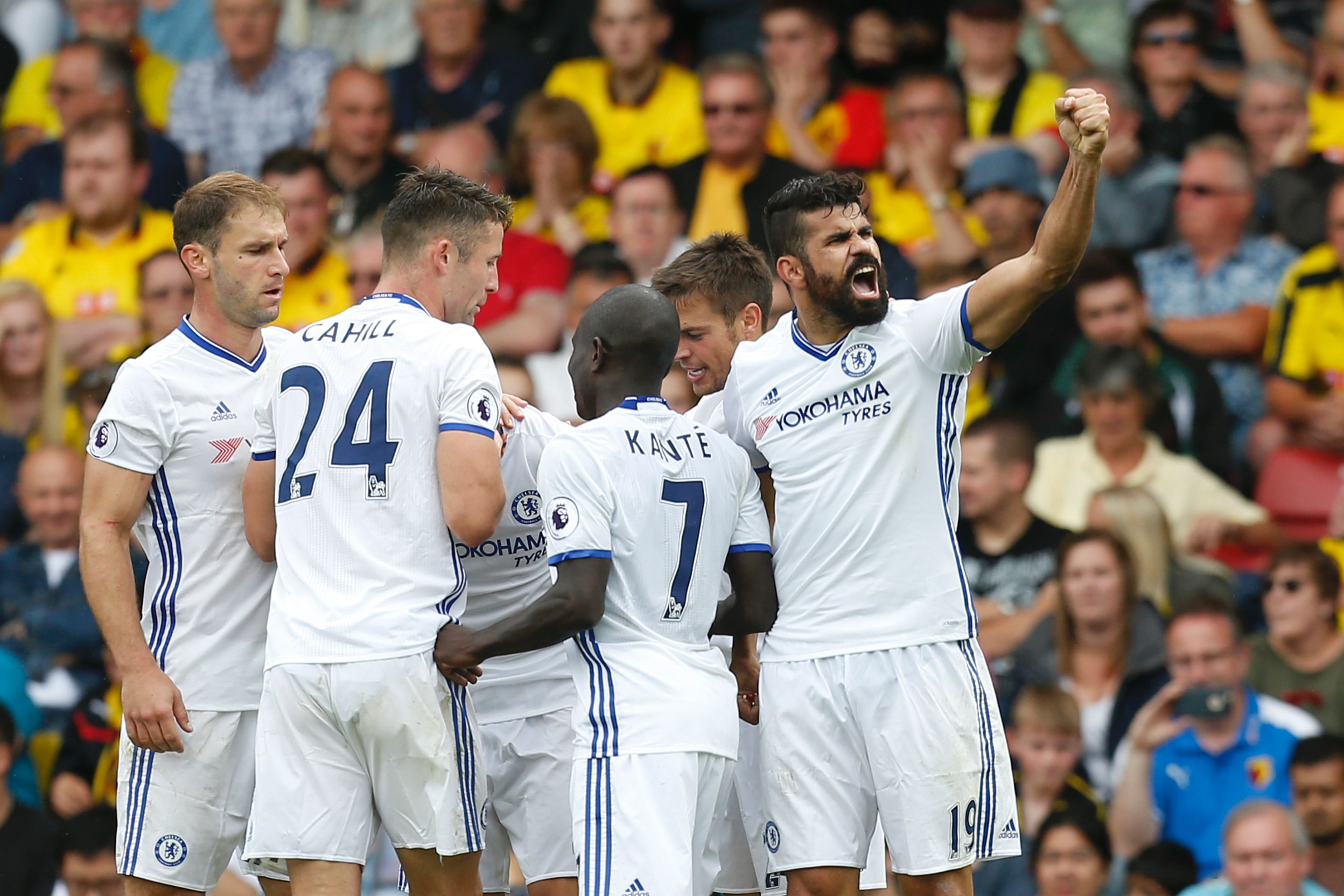 Chelsea's Brazilian-born Spanish striker Diego Costa (R) celebrates scoring their second goal during the English Premier League football match between Watford and Chelsea at Vicarage Road Stadium in Watford, north of London on August 20, 2016. / AFP / Ian Kington / RESTRICTED TO EDITORIAL USE. No use with unauthorized audio, video, data, fixture lists, club/league logos or 'live' services. Online in-match use limited to 75 images, no video emulation. No use in betting, games or single club/league/player publications.  /         (Photo credit should read IAN KINGTON/AFP/Getty Images)