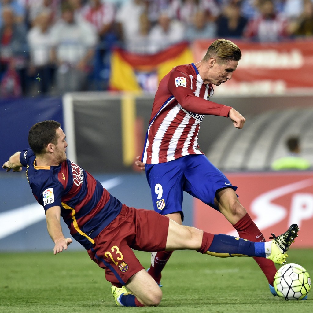 Barcelona's Belgian defender Thomas Vermaelen (L) vies with Atletico Madrid's forward Fernando Torres during the Spanish league football match Club Atletico de Madrid vs FC Barcelona at the Vicente Calderon stadium in Madrid on September 12, 2015. AFP PHOTO/ GERARD JULIEN (Photo credit should read GERARD JULIEN/AFP/Getty Images)