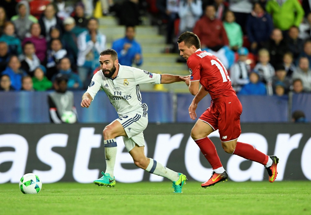 Real Madrid's Spanish defender Dani Carvajal (L) and Sevilla's Ukrainian midfielder Yevhen Konoplyanka vie for the ball during the UEFA Super Cup final football match between Real Madrid CF and Sevilla FC on August 9, 2016 at the Lerkendal Stadium in Trondheim. / AFP / JONATHAN NACKSTRAND (Photo credit should read JONATHAN NACKSTRAND/AFP/Getty Images)
