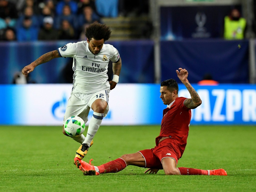 Real Madrid's Brazilian defender Marcelo (L) and Sevilla's Spanish midfielder Vitolo vie for the ball during the UEFA Super Cup final football match between Real Madrid CF and Sevilla FC on August 9, 2016 at the Lerkendal Stadium in Trondheim. / AFP / JONATHAN NACKSTRAND (Photo credit should read JONATHAN NACKSTRAND/AFP/Getty Images)
