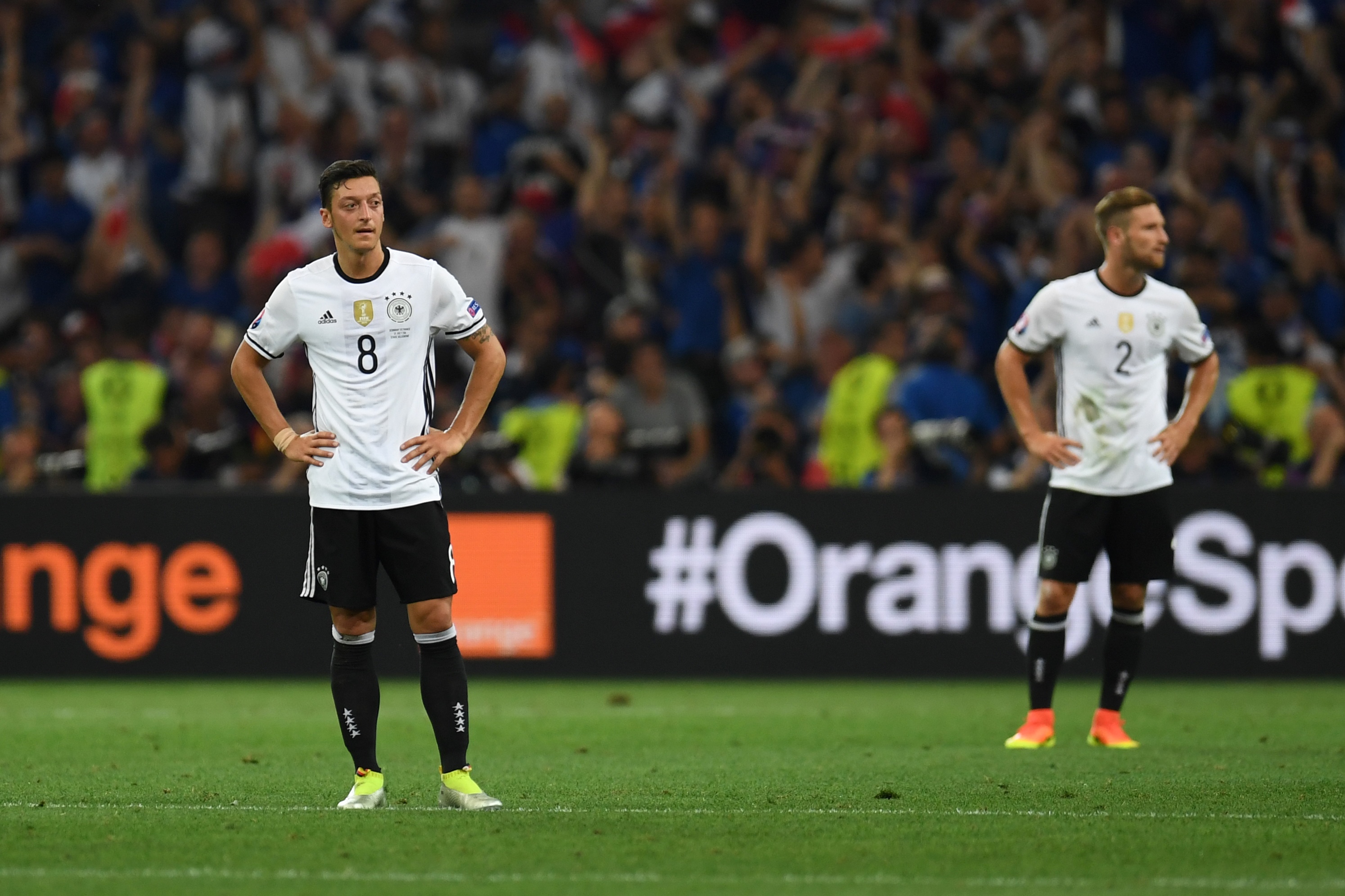 Germany's midfielder Mesut Oezil (L) and Germany's defender Shkodran Mustafi react after France's forward Antoine Griezmann (unseen) scores the second goal for France during the Euro 2016 semi-final football match between Germany and France at the Stade Velodrome in Marseille on July 7, 2016.
 / AFP / PATRIK STOLLARZ        (Photo credit should read PATRIK STOLLARZ/AFP/Getty Images)
