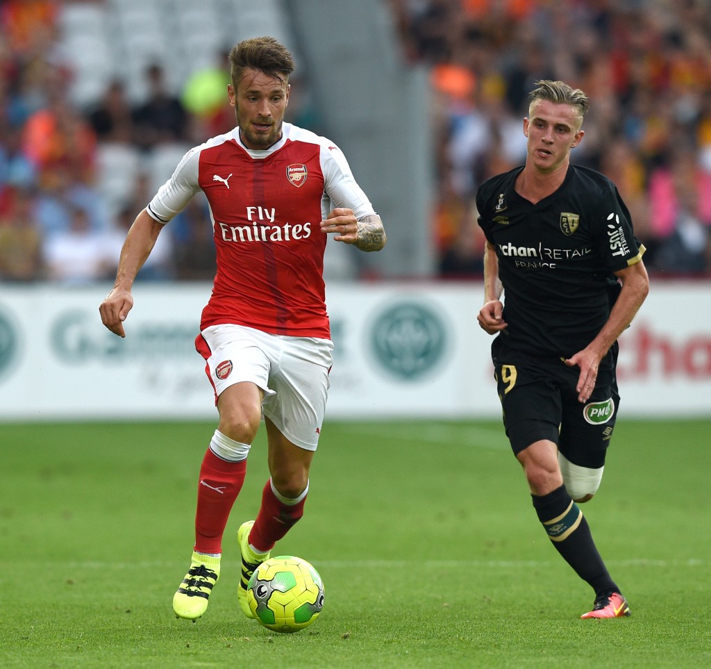 Arsenal's french defender Mathieu Debuchy vies with Lens's midfielder Benjamin Bourigeaud (R) during the football match Lens Vs Arsenal on July 22 2016, at the Felix Bollaert stadium in Lens. / AFP / DENIS CHARLET (Photo credit should read DENIS CHARLET/AFP/Getty Images)