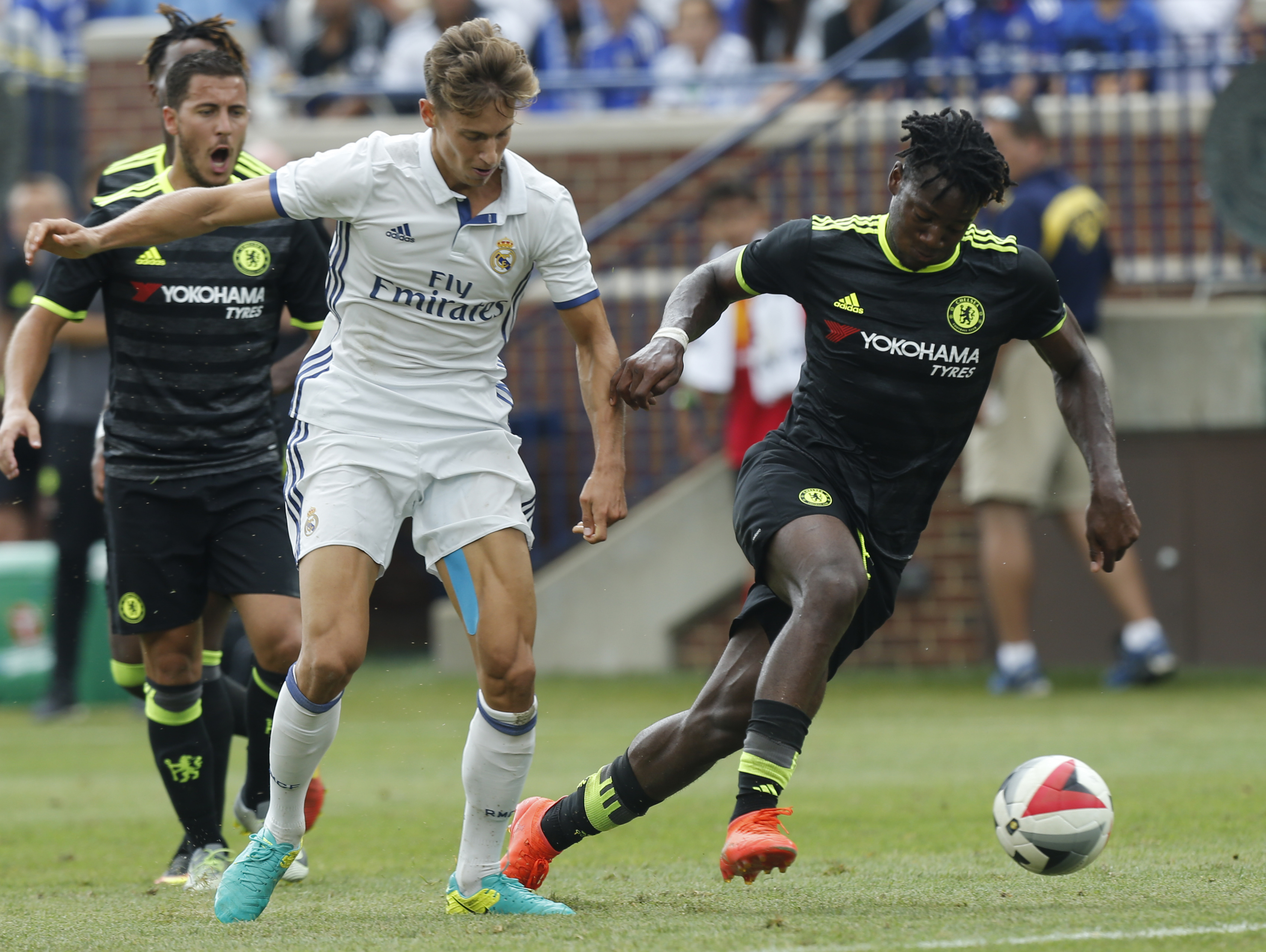 Chelsea forward Michy Batshuayi (R) and Real Real Madrid midfielder Marcos Llorente (L) chase a loose ball during an International Champions Cup soccer match in Ann Arbor, Michigan on July 30, 2016. / AFP / Jay LaPrete (Photo credit should read JAY LAPRETE/AFP/Getty Images)