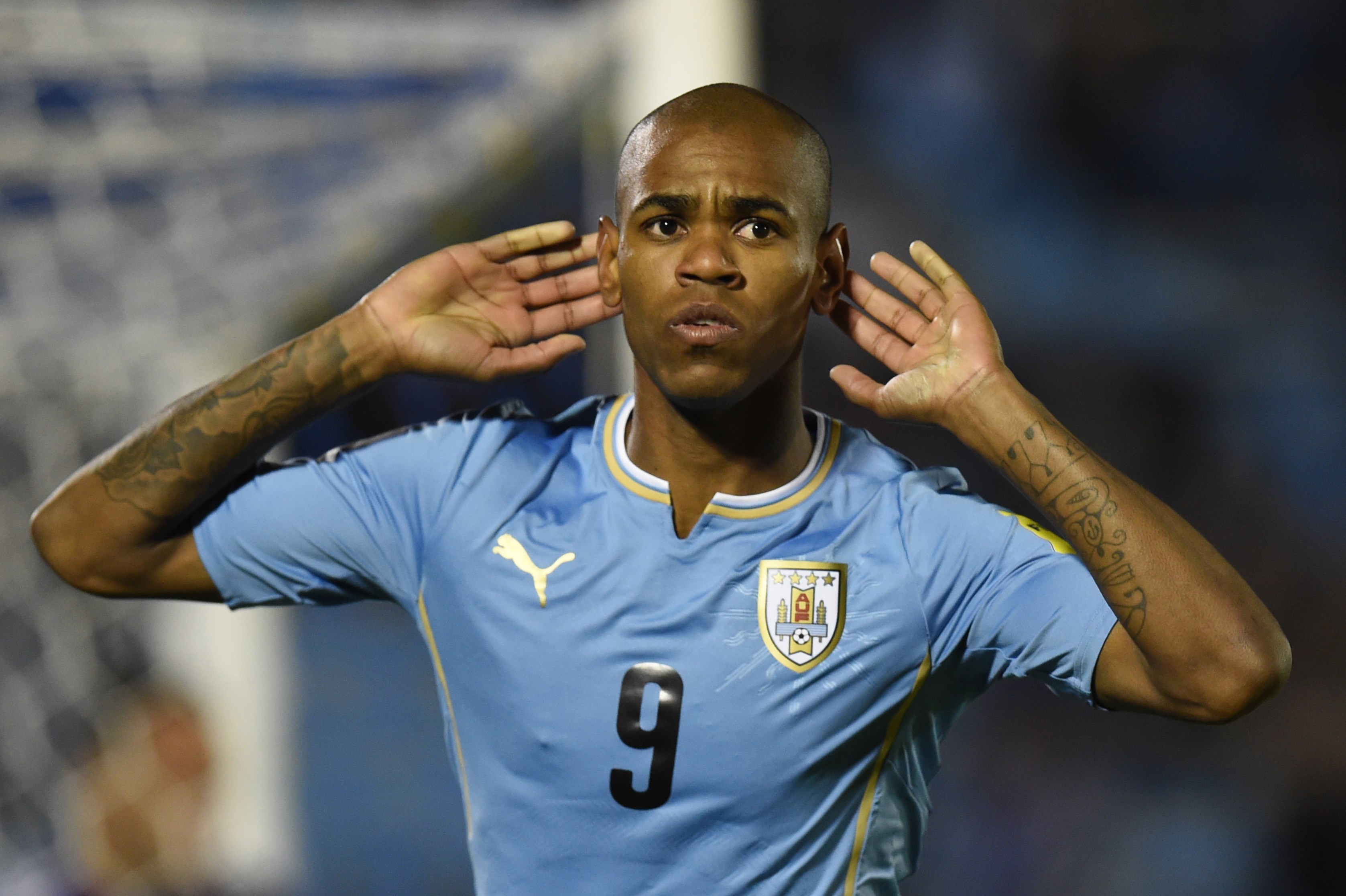 Uruguay's forward Diego Rolan celebrates after scoring against Colombia during their Russia 2018 FIFA World Cup South American Qualifiers football match, at the Estadio Centenario stadium in Montevideo, on October 13, 2015.   AFP PHOTO / PABLO PORCIUNCULA        (Photo credit should read PABLO PORCIUNCULA/AFP/Getty Images)