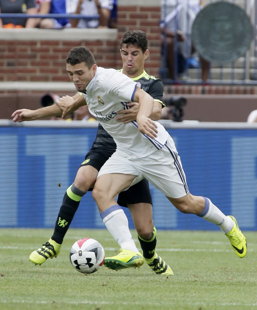 ANN ARBOR, MI - JULY 30: Marco Asensio #28 of Real Madrid is held by Oscar #8 of Chelsea during the first half at Michigan Stadium on July 30, 2016 in Ann Arbor, Michigan. (Photo by Duane Burleson/Getty Images)