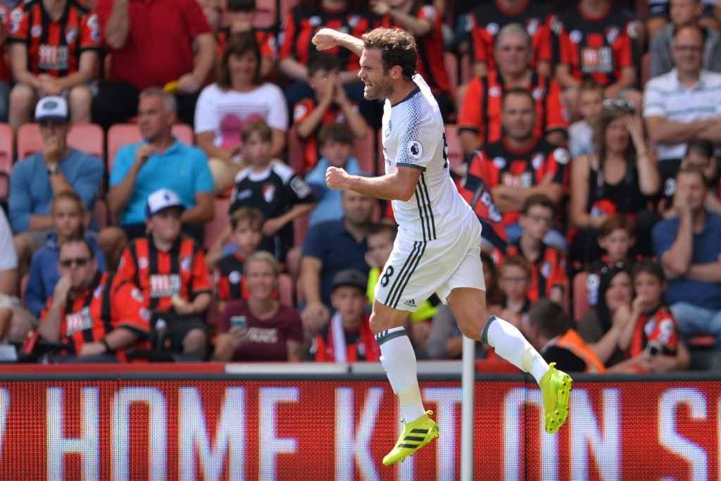Manchester United's Spanish midfielder Juan Mata celerbates scoring the opening goal during the English Premier League football match between Bournemouth and Manchester United at the Vitality Stadium in Bournemouth, southern England on August 14, 2016. / AFP / GLYN KIRK / RESTRICTED TO EDITORIAL USE. No use with unauthorized audio, video, data, fixture lists, club/league logos or 'live' services. Online in-match use limited to 75 images, no video emulation. No use in betting, games or single club/league/player publications. / (Photo credit should read GLYN KIRK/AFP/Getty Images)