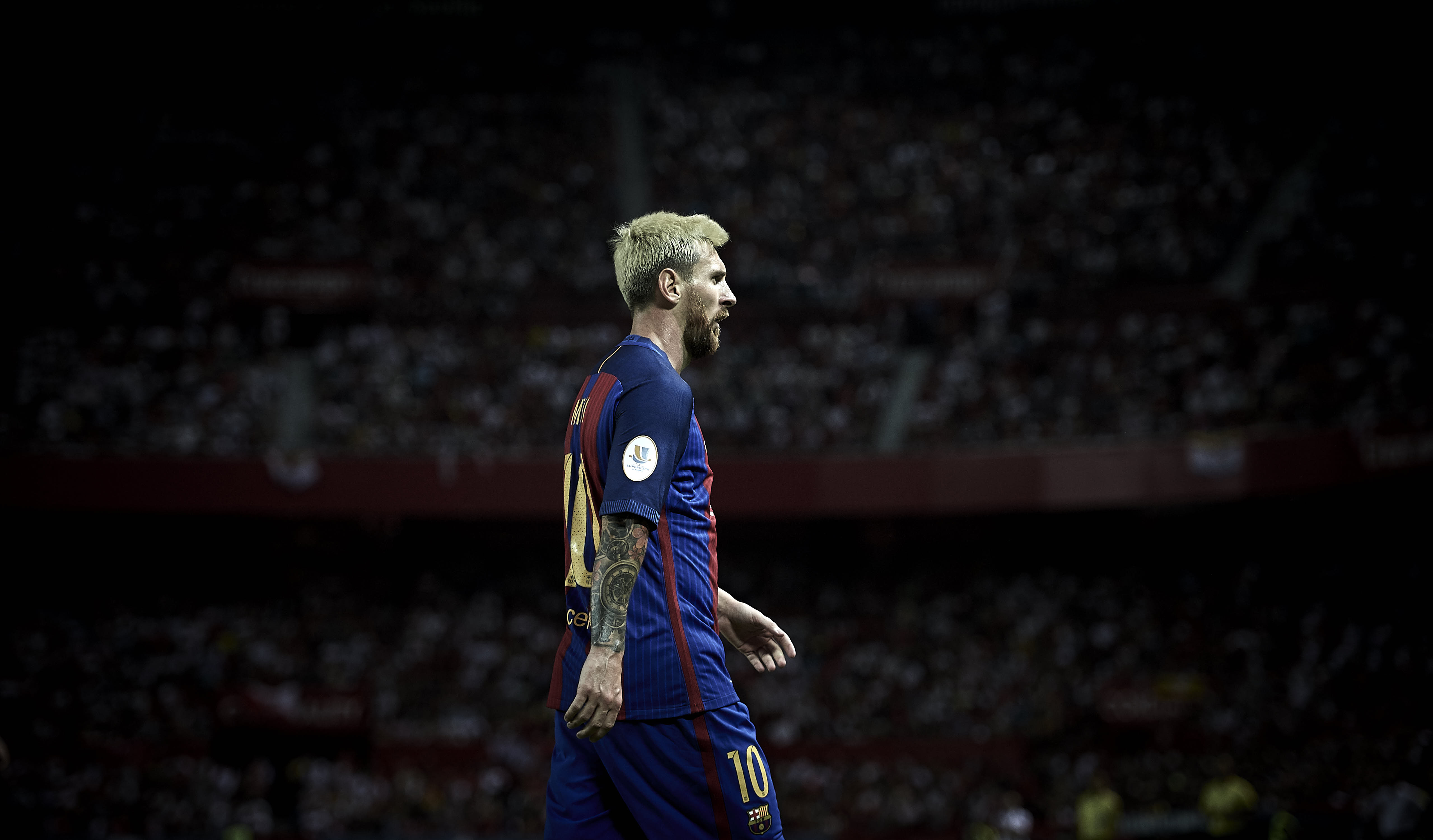 SEVILLE, SPAIN - AUGUST 14:  Lionel Messi of FC Barcelona looks on during the match between Sevilla FC vs FC Barcelona as part of the Spanish Super Cup Final 1st Leg  at Estadio Ramon Sanchez Pizjuan on August 14, 2016 in Seville, Spain.  (Photo by Aitor Alcalde/Getty Images)
