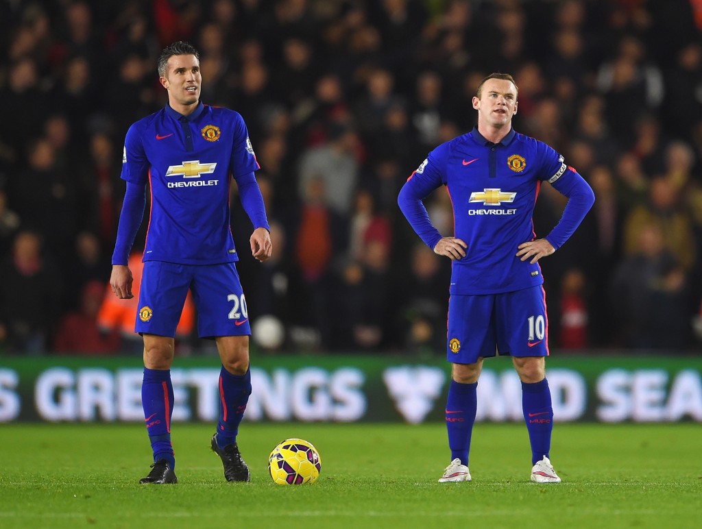 SOUTHAMPTON, ENGLAND - DECEMBER 08: Robin van Persie and Wayne Rooney of Manchester United look dejected after the equalising goal by Graziano Pelle of Southampton during the Barclays Premier League match between Southampton and Manchester United at St Mary's Stadium on December 8, 2014 in Southampton, England. (Photo by Michael Regan/Getty Images)