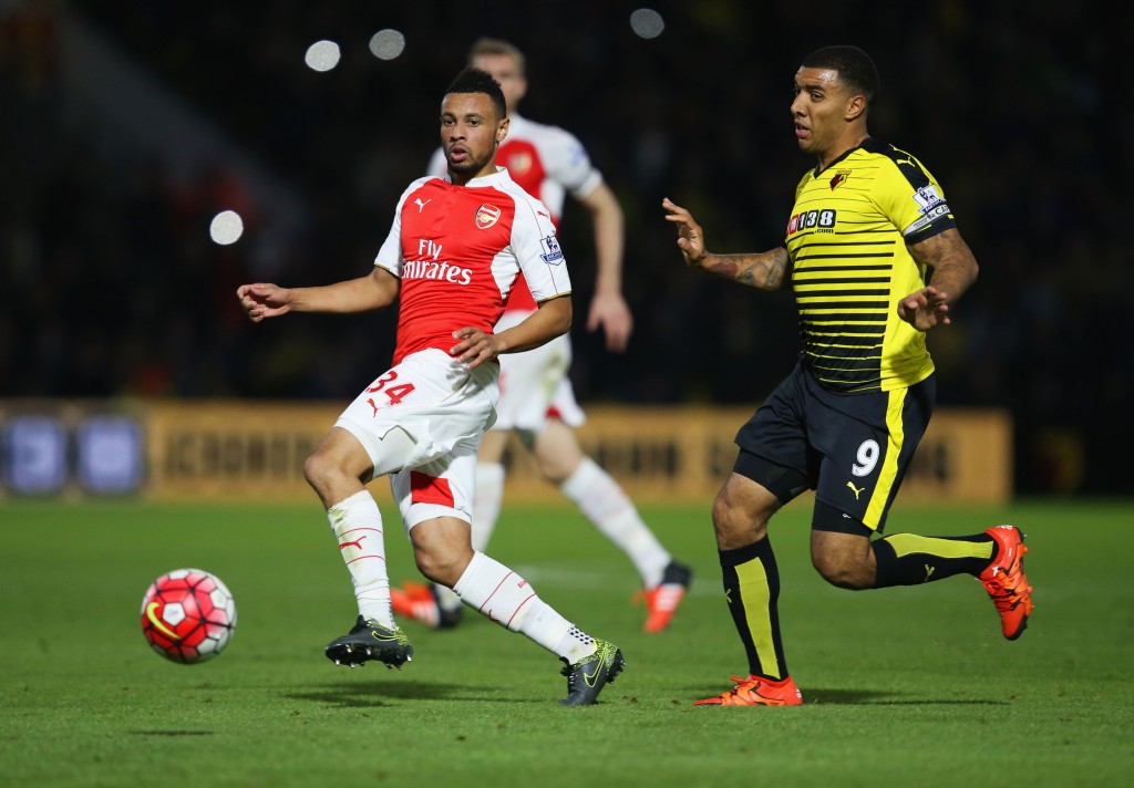 WATFORD, ENGLAND - OCTOBER 17: Francis Coquelin of Arsenal moves the ball away from Troy Deeney of Watford during the Barclays Premier League match between Watford and Arsenal at Vicarage Road on October 17, 2015 in Watford, England. (Photo by Jan Kruger/Getty Images)