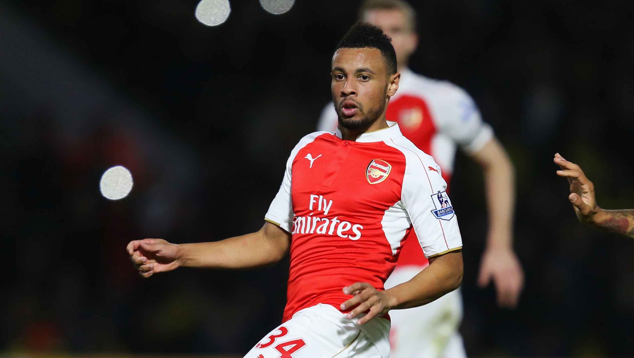WATFORD, ENGLAND - OCTOBER 17:  Francis Coquelin of Arsenal moves the ball away from Troy Deeney of Watford during the Barclays Premier League match between Watford and Arsenal at Vicarage Road on October 17, 2015 in Watford, England.  (Photo by Jan Kruger/Getty Images)