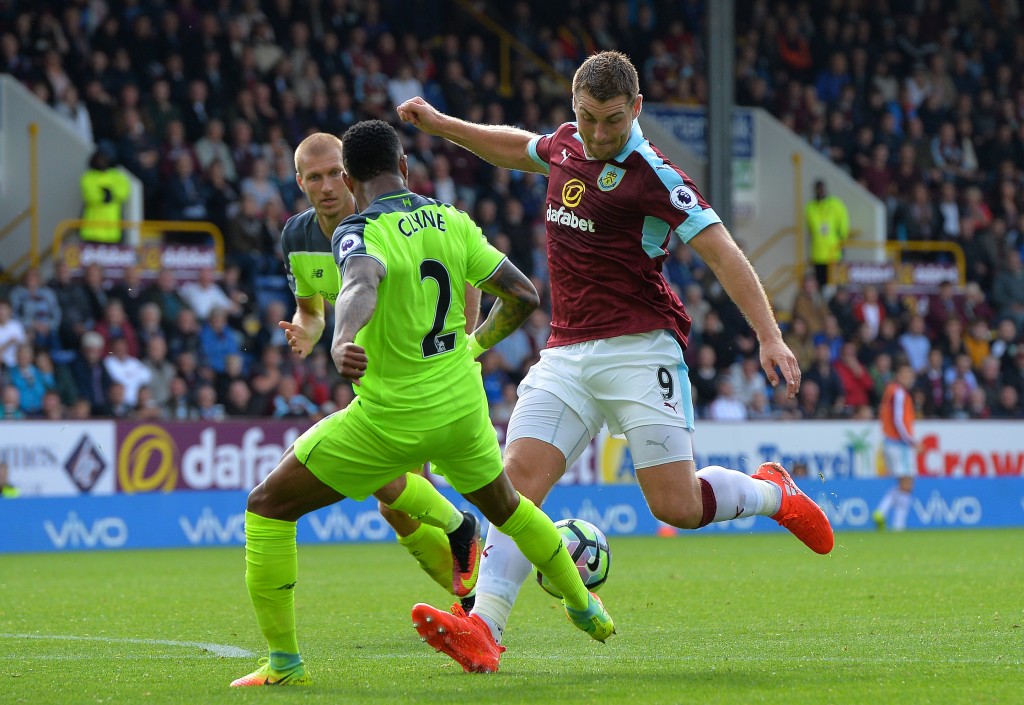 BURNLEY, ENGLAND - AUGUST 20: Sam Vokes of Burnley takes on Nathaniel Clyne of Liverpool during the Premier League match between Burnley FC and Liverpool FC at Turf Moor on August 20, 2016 in Burnley, England. (Photo by Mark Runnacles/Getty Images)