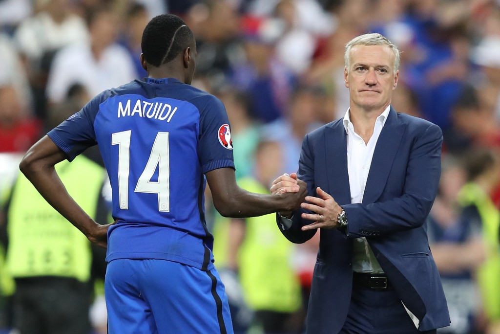 France's midfielder Blaise Matuidi (L) and France's coach Didier Deschamps react after France lost the Euro 2016 final football match against Portugal at the Stade de France in Saint-Denis, north of Paris, on July 10, 2016. / AFP / Valery HACHE (Photo credit should read VALERY HACHE/AFP/Getty Images)