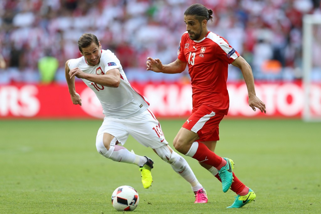 Switzerland's defender Ricardo Rodriguez (R) and Poland's midfielder Grzegorz Krychowiak vie for the ball during the Euro 2016 round of sixteen football match between Switzerland and Poland at the Geoffroy-Guichard stadium in Saint-Etienne on June 25, 2016. / AFP / Valery HACHE (Photo credit should read VALERY HACHE/AFP/Getty Images)