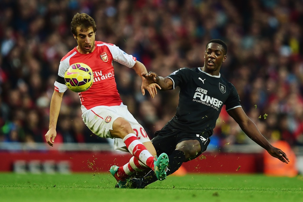 LONDON, ENGLAND - NOVEMBER 01: Mathieu Flamini of Arsenal is tackeld by Marvin Sordell of Burnley during the Barclays Premier League match between Arsenal and Burnley at Emirates Stadium on November 1, 2014 in London, England. (Photo by Jamie McDonald/Getty Images)