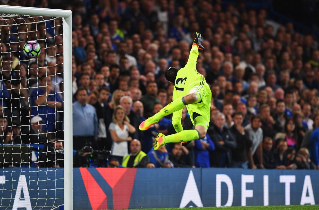 LONDON, ENGLAND - SEPTEMBER 16: Thibaut Courtois of Chelsea dives in vain as Jordan Henderson of Liverpool scores their second goal during the Premier League match between Chelsea and Liverpool at Stamford Bridge on September 16, 2016 in London, England. (Photo by Shaun Botterill/Getty Images)