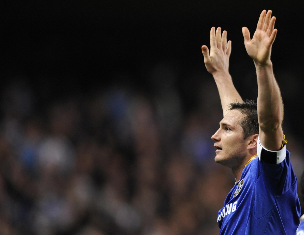 Chelsea's Frank Lampard (C) celebrates scoring his teams' fourth goal against Liverpool during the UEFA Champions League quarter-final second leg football match at Stamford Bridge in London April 14, 2009. Lampard scored twice in the game with the final score 4-4. Chelsea advance to the semi-final after winning 7-5 on aggregate. AFP PHOTO / Adrian Dennis (Photo credit should read ADRIAN DENNIS/AFP/Getty Images)
