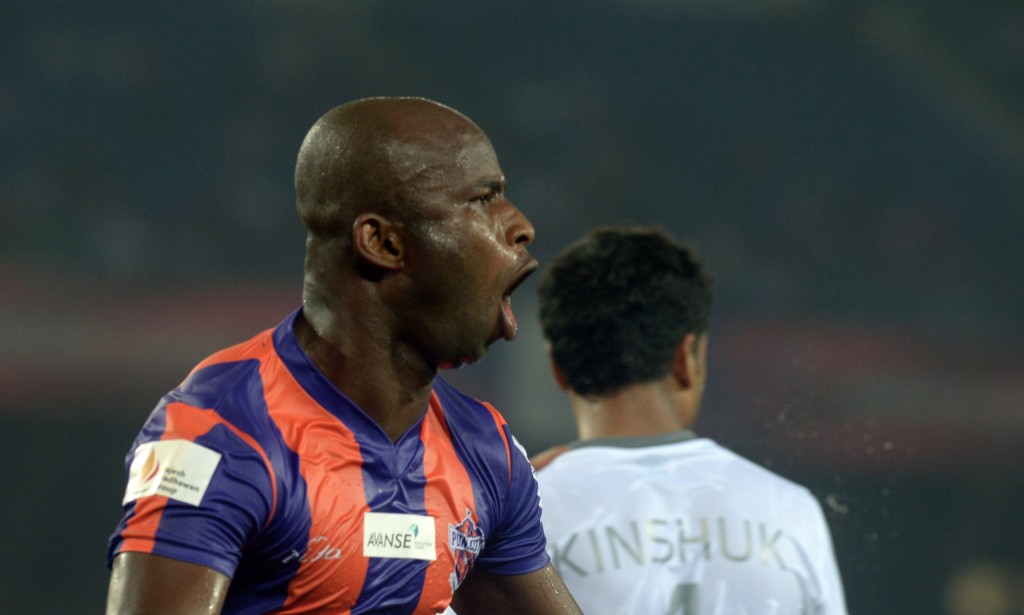 FC Pune City footballer Dudu Omagbemi celebrates after scoring a goal during the Indian Super League (ISL) football match between Atletico de Kolkata and FC Pune City at The Salt Lake Stadium in Kolkata on November 7, 2014. AFP PHOTO/Dibyangshu SARKAR (Photo credit should read DIBYANGSHU SARKAR/AFP/Getty Images)