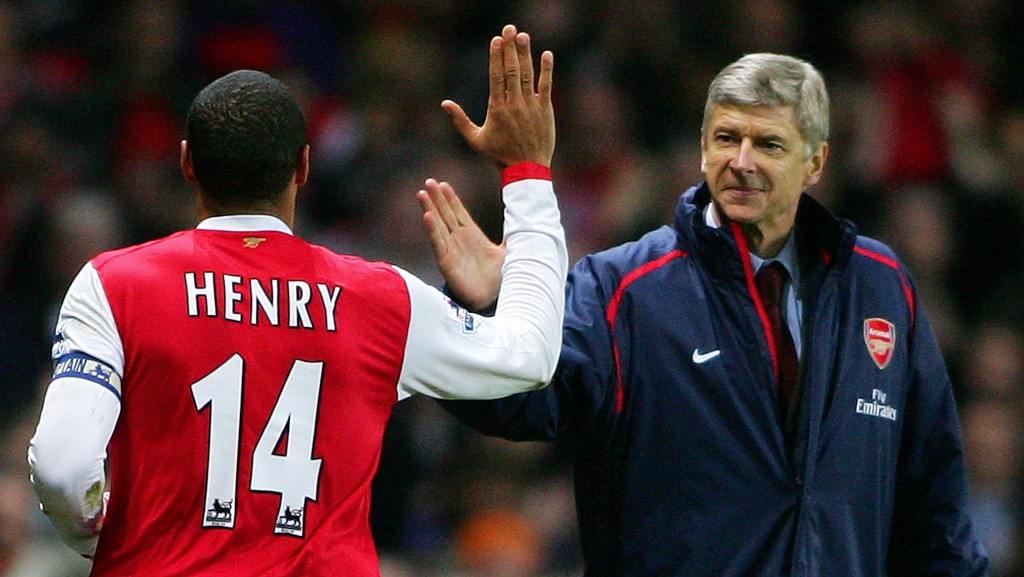 Arsenal's Captain, Frenchman Thierry Henry (L) celebrates with countryman manager Arsene Wenger (R) after scoring from a penalty shot during their Premiership match against Charlton at home to Arsenal, 02 January 2006. (Photo by Carl de Souza/AFP/Getty Images)