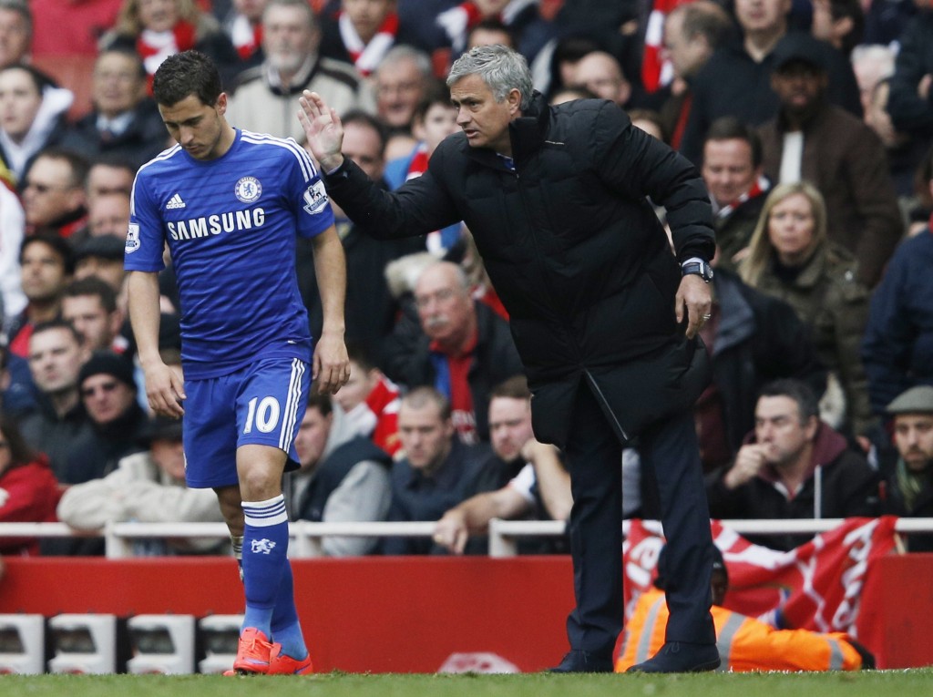 Chelsea's Portuguese manager Jose Mourinho (R) speaks with Chelsea's Belgian midfielder Eden Hazard during the English Premier League football match between Arsenal and Chelsea at the Emirates Stadium in London on April 26, 2015. AFP PHOTO / ADRIAN DENNIS RESTRICTED TO EDITORIAL USE. No use with unauthorized audio, video, data, fixture lists, club/league logos or live services. Online in-match use limited to 45 images, no video emulation. No use in betting, games or single club/league/player publications. (Photo credit should read ADRIAN DENNIS/AFP/Getty Images)