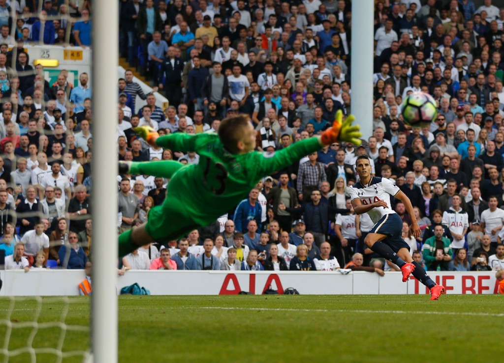 Tottenham Hotspur's Argentinian midfielder Erik Lamela (R) sees his shot saved by Sunderland's English goalkeeper Jordan Pickford during the English Premier League football match between Tottenham Hotspur and Sunderland at White Hart Lane in London, on September 18, 2016. (Photo by Ian Kington/AFP/Getty Images)