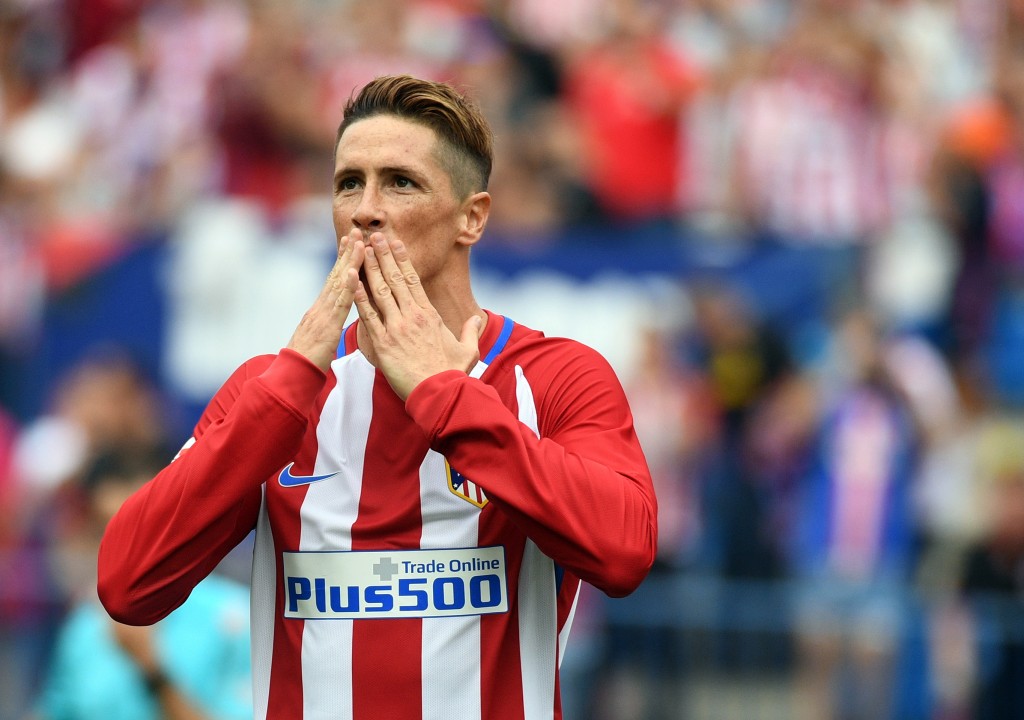 Atletico Madrid's forward Fernando Torres celebrates after scoring a penalty during the Spanish league football match Club Atletico de Madrid vs Real Sporting de Gijon at the Vicente Calderon stadium in Madrid on September 17, 2016. / AFP / GERARD JULIEN (Photo credit should read GERARD JULIEN/AFP/Getty Images)