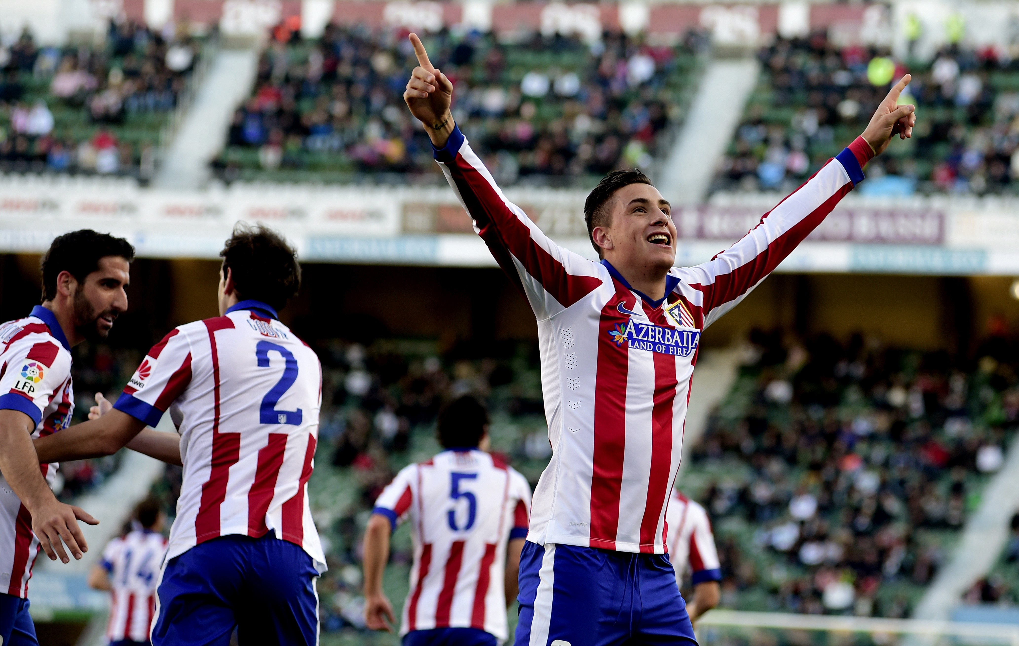 Atletico Madrid's Uruguayan defender Jose Maria Gimenez celebrates after scoring during the Spanish league football match Elche FC vs Club Atletico Madrid at the Martin Valero stadium in Valencia on December 6, 2014. (Photo credit should read JOSE JORDAN/AFP/Getty Images)