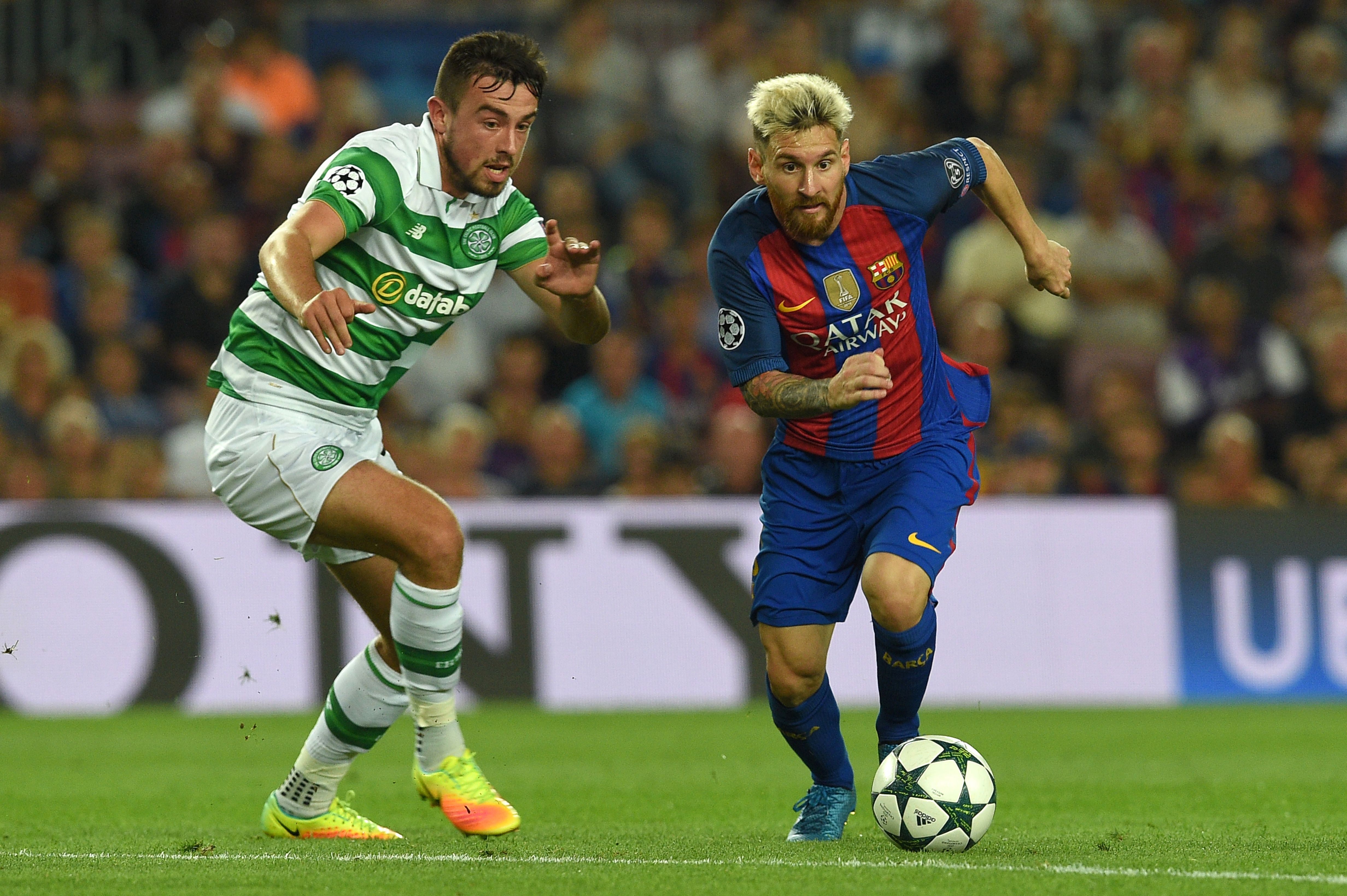 Barcelona's Argentinian forward Lionel Messi (R) vies with Celtic's Irish defender Eoghan O'Connell during the UEFA Champions League football match FC Barcelona vs Celtic FC at the Camp Nou stadium in Barcelona on September 13, 2016. (Photo by Lluis Gene/AFP/Getty Images)