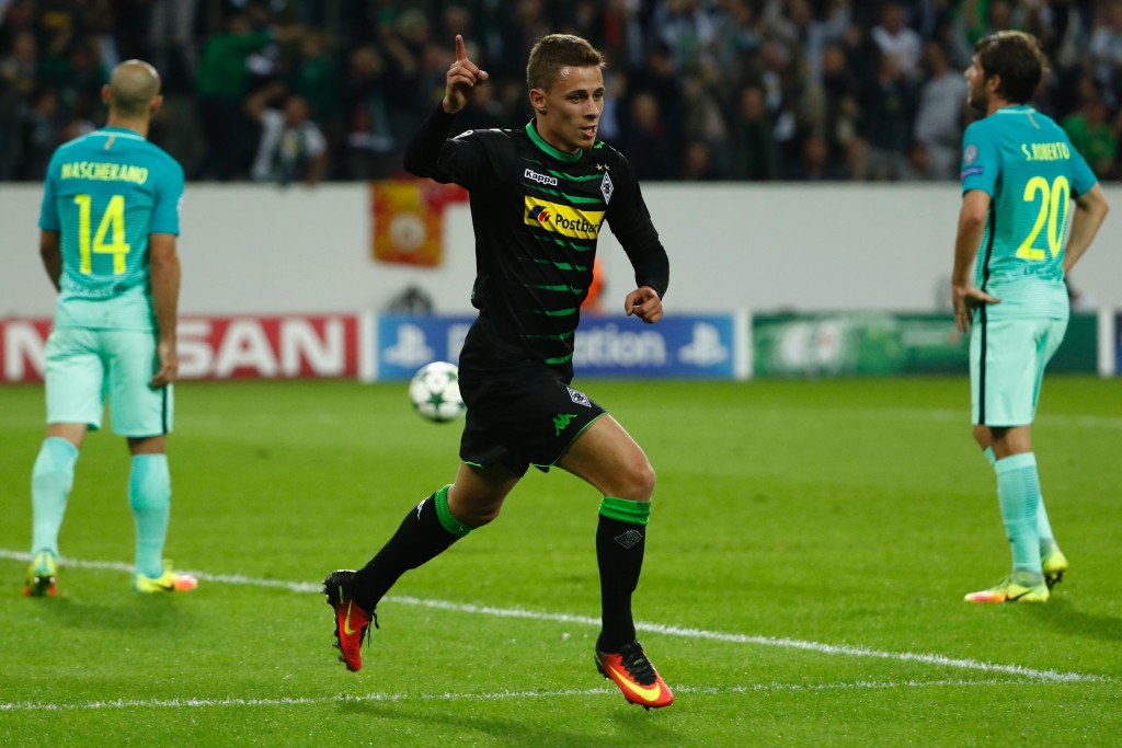 Moenchengladbach's Belgian midfielder Thorgan Hazard (C) celebrates after scoring the opening goal during the UEFA Champions League first-leg group C football match between Borussia Moenchengladbach and FC Barcelona at the Borussia Park in Moenchengladbach, western Germany on September 28, 2016. / AFP / Odd ANDERSEN (Photo credit should read ODD ANDERSEN/AFP/Getty Images)