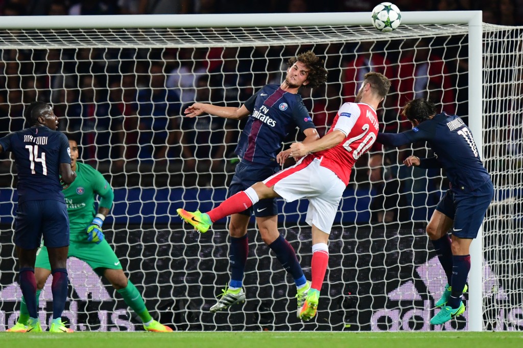 Paris Saint-Germain's French midfielder Adrien Rabiot (3rdR) vies with Arsenal's German defender Shkodran Mustafi (2ndR), next to Paris Saint-Germain's Brazilian defender Maxwell (R), and Paris Saint-Germain's French midfielder Blaise Matuidi (L) during the UEFA Champions League Group A football match between Paris-Saint-Germain vs Arsenal FC, on September 13, 2016 at the Parc des Princes stadium in Paris. AFP PHOTO / FRANCK FIFE / AFP / FRANCK FIFE (Photo credit should read FRANCK FIFE/AFP/Getty Images)