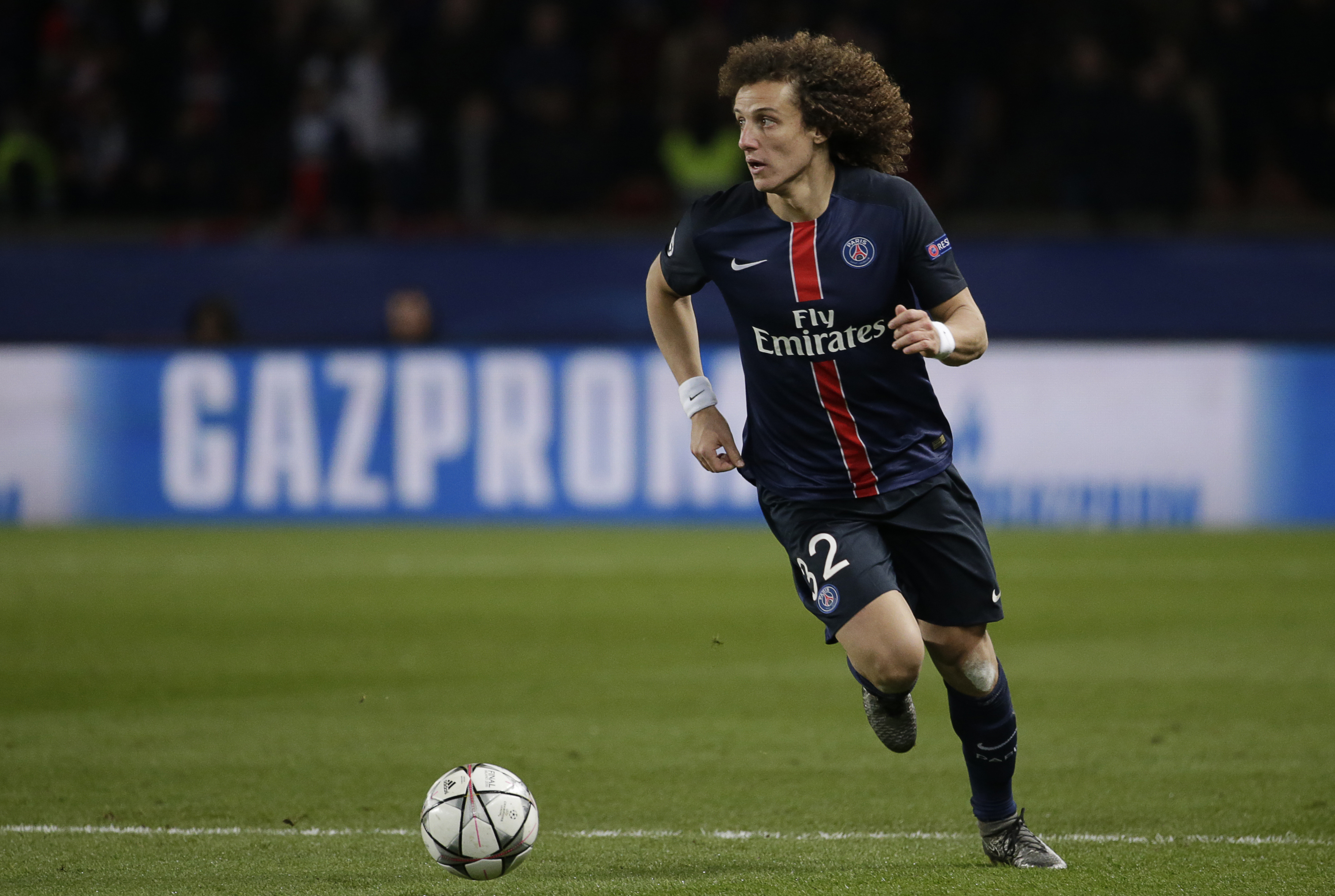Paris Saint-Germain's Brazilian defender David Luiz runs with the ball during the Champions League round of 16 first leg football match between Paris Saint-Germain (PSG) and Chelsea FC on February 16, 2016, at the Parc des Princes stadium in Paris. AFP PHOTO / KENZO TRIBOUILLARD / AFP / KENZO TRIBOUILLARD (Photo credit should read KENZO TRIBOUILLARD/AFP/Getty Images)