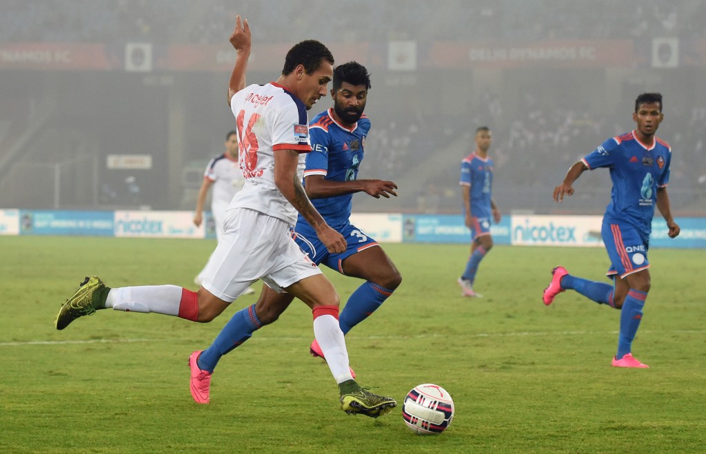 Delhi Dynamos FC Brazilian forward Gustavo Marmentini dos Santos (L) shoots the ball past FC Goa's Indian forward CS Sabeeth during the first leg of the semi-final football match between Delhi Dynamos FC and FC Goa of Indian Super League (ISL) at Jawahar Lal Nehru Stadium in New Delhi on December 11, 2015. AFP PHOTO / SAJJAD HUSSAIN / AFP / SAJJAD HUSSAIN (Photo credit should read SAJJAD HUSSAIN/AFP/Getty Images)