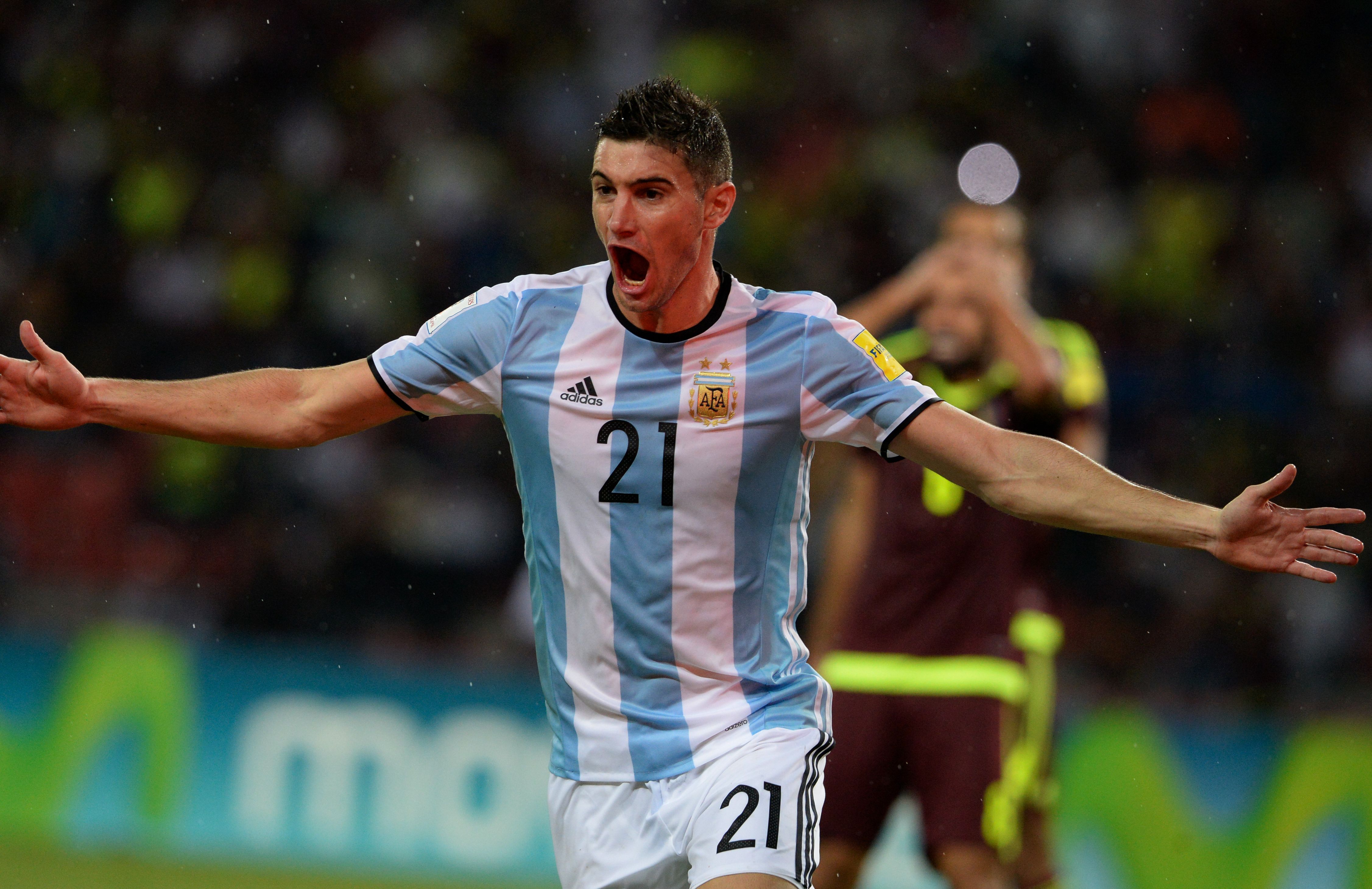 Argentina's Lucas Alario celebrates after a teammate scored against Venezuela during their Russia 2018 World Cup football qualifier match in Merida, Venezuela, on September 6, 2016. / AFP / FEDERICO PARRA (Photo credit should read FEDERICO PARRA/AFP/Getty Images)