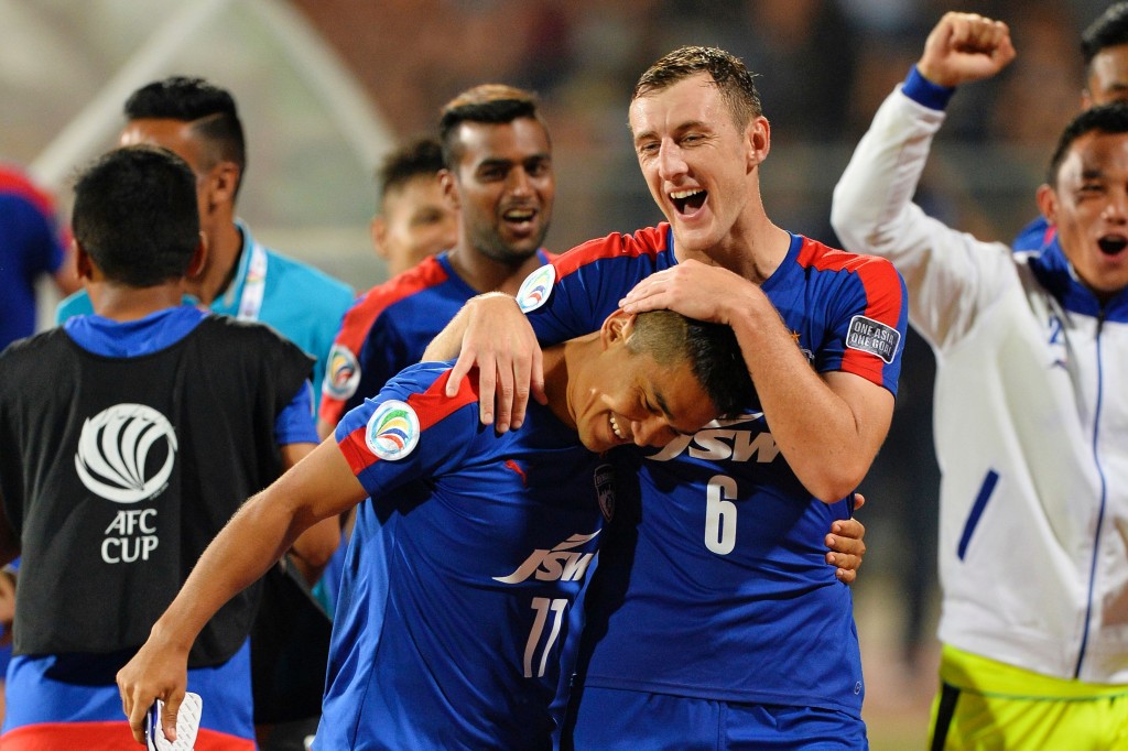 Bengaluru's John Johnson (R) congratulates his team captain Sunil Chhetri on scoring two goals as they celebrate after winning the 2016 Asian Football Confederation (AFC) Cup semi-final second leg football match between Bengaluru FC and Johor Darul Ta'zim at the Shree Kanteerava stadium in Bangalore, on October 19, 2016. / AFP / MANJUNATH KIRAN (Photo credit should read MANJUNATH KIRAN/AFP/Getty Images)