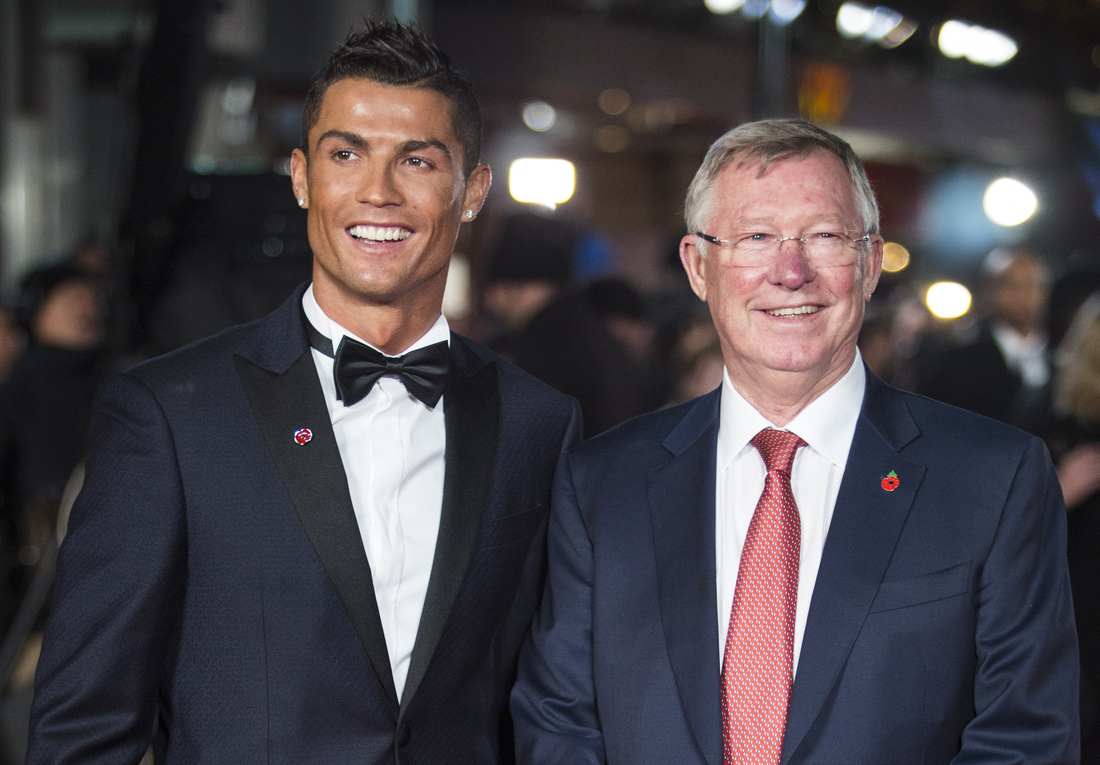Real Madrid's Portuguese forward Cristiano Ronaldo (L) poses with former Manchester United manager Sir Alex Ferguson at the world premiere of the film Ronaldo in central London on November 9, 2015.
AFP PHOTO / JACK TAYLOR / AFP / JACK TAYLOR        (Photo credit should read JACK TAYLOR/AFP/Getty Images)