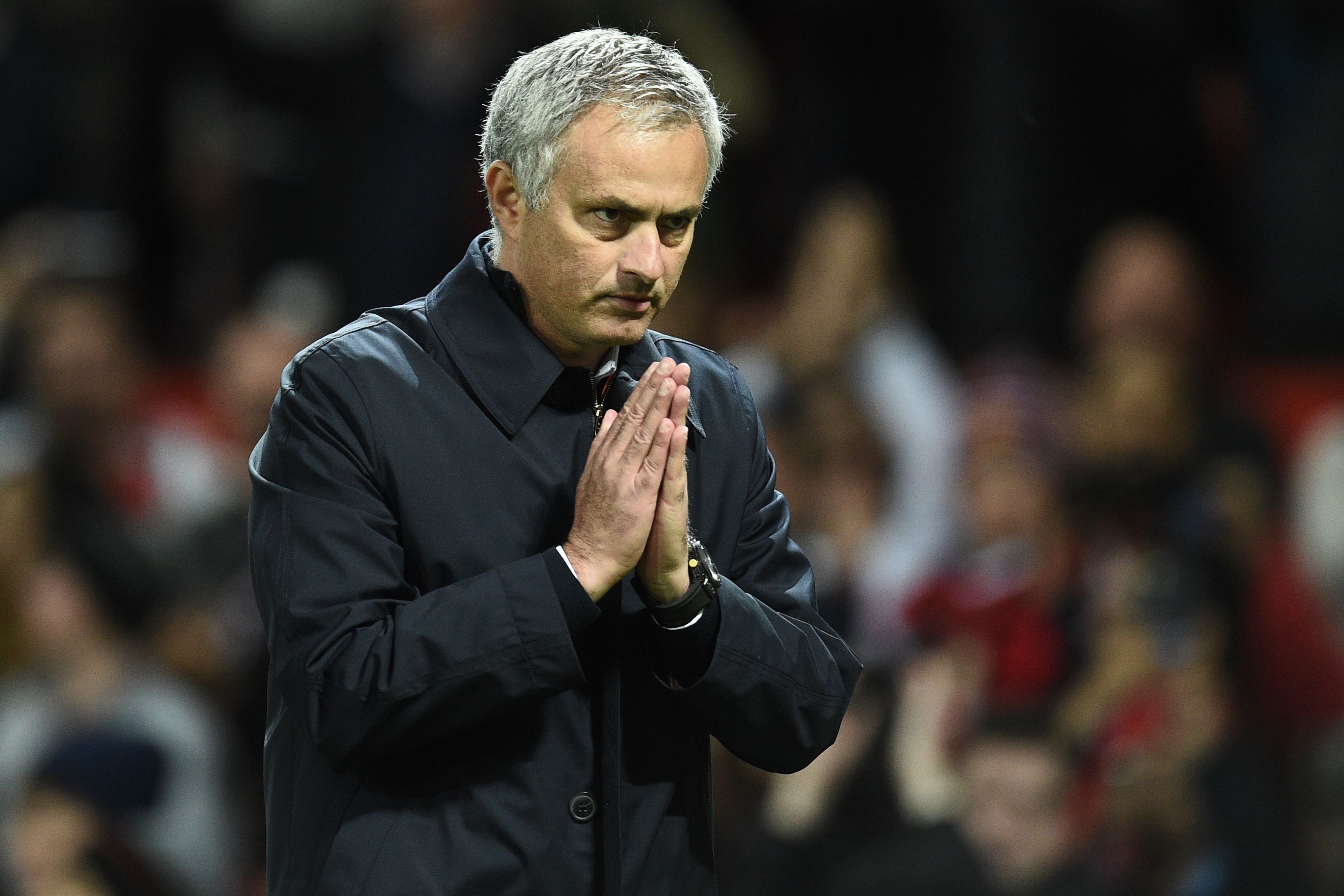 Manchester United's Portuguese manager Jose Mourinho gestures to supporters after the EFL (English Football League) Cup fourth round match between Manchester United and Manchester City at Old Trafford in Manchester, north west England on October 26, 2016.
Manchester United won the game 1-0. / AFP / Oli SCARFF / RESTRICTED TO EDITORIAL USE. No use with unauthorized audio, video, data, fixture lists, club/league logos or 'live' services. Online in-match use limited to 75 images, no video emulation. No use in betting, games or single club/league/player publications.  /         (Photo credit should read OLI SCARFF/AFP/Getty Images)