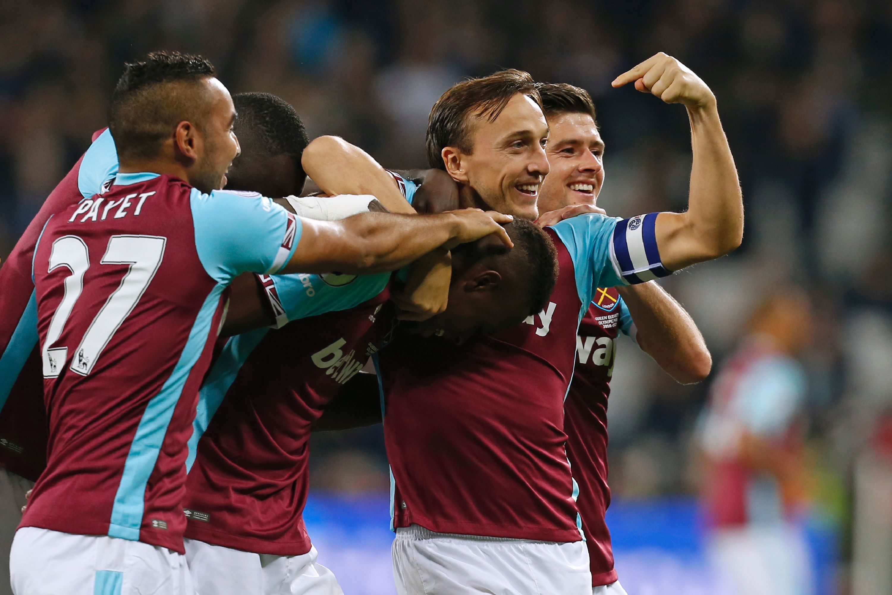 West Ham United's Swiss midfielder Edimilson Fernandes (C) celebrates with teammates after scoring their second goal during the EFL (English Football League) Cup fourth round match between West Ham United and Chelsea at The London Stadium in east London on October 26, 2016. / AFP / Ian KINGTON / RESTRICTED TO EDITORIAL USE. No use with unauthorized audio, video, data, fixture lists, club/league logos or 'live' services. Online in-match use limited to 75 images, no video emulation. No use in betting, games or single club/league/player publications. / (Photo credit should read IAN KINGTON/AFP/Getty Images)