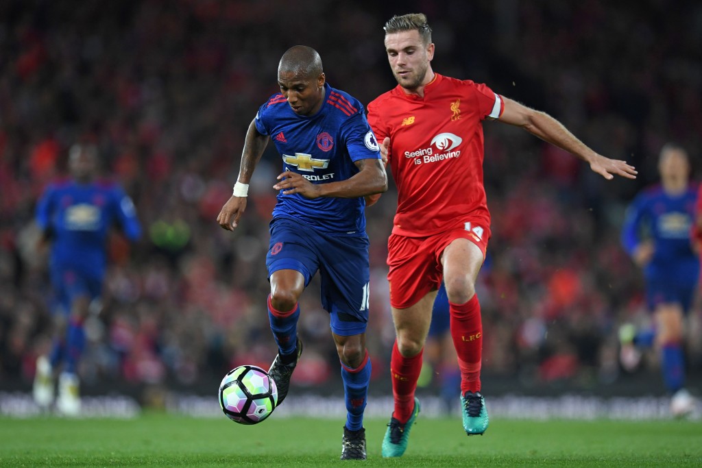 Manchester United's English midfielder Ashley Young (L) vies with Liverpool's English midfielder Jordan Henderson during the English Premier League football match between Liverpool and Manchester United at Anfield in Liverpool, north west England on October 17, 2016. / AFP / Paul ELLIS / RESTRICTED TO EDITORIAL USE. No use with unauthorized audio, video, data, fixture lists, club/league logos or 'live' services. Online in-match use limited to 75 images, no video emulation. No use in betting, games or single club/league/player publications. / (Photo credit should read PAUL ELLIS/AFP/Getty Images)