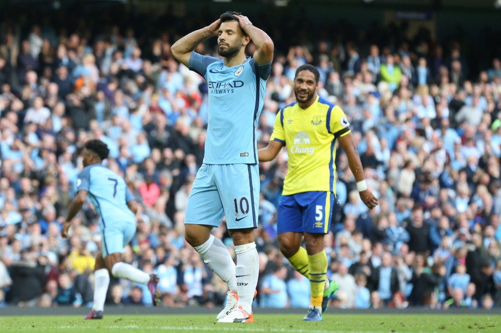 Manchester City's Argentinian striker Sergio Aguero reacts after missing a penalty during the English Premier League football match between Manchester City and Everton at the Etihad Stadium in Manchester, north west England, on October 15, 2016. / AFP / SCOTT HEPPELL / RESTRICTED TO EDITORIAL USE. No use with unauthorized audio, video, data, fixture lists, club/league logos or 'live' services. Online in-match use limited to 75 images, no video emulation. No use in betting, games or single club/league/player publications. / (Photo credit should read SCOTT HEPPELL/AFP/Getty Images)