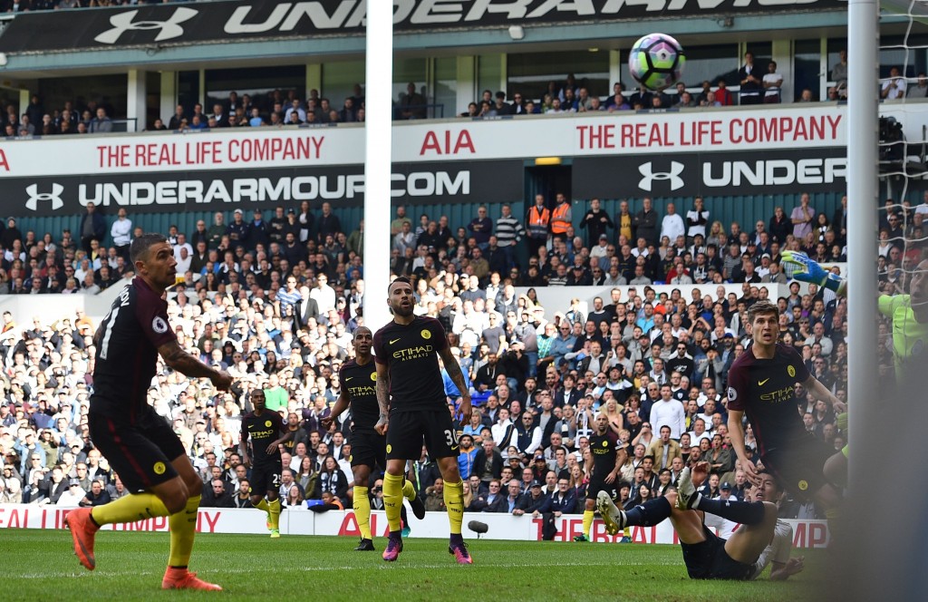 Manchester City's Serbian defender Aleksandar Kolarov (L) watches his attempted clearance bounce into the net for an own goal during the English Premier League football match between Tottenham Hotspur and Manchester City at White Hart Lane in London, on October 2, 2016. / AFP / Glyn KIRK / RESTRICTED TO EDITORIAL USE. No use with unauthorized audio, video, data, fixture lists, club/league logos or 'live' services. Online in-match use limited to 75 images, no video emulation. No use in betting, games or single club/league/player publications. / (Photo credit should read GLYN KIRK/AFP/Getty Images)