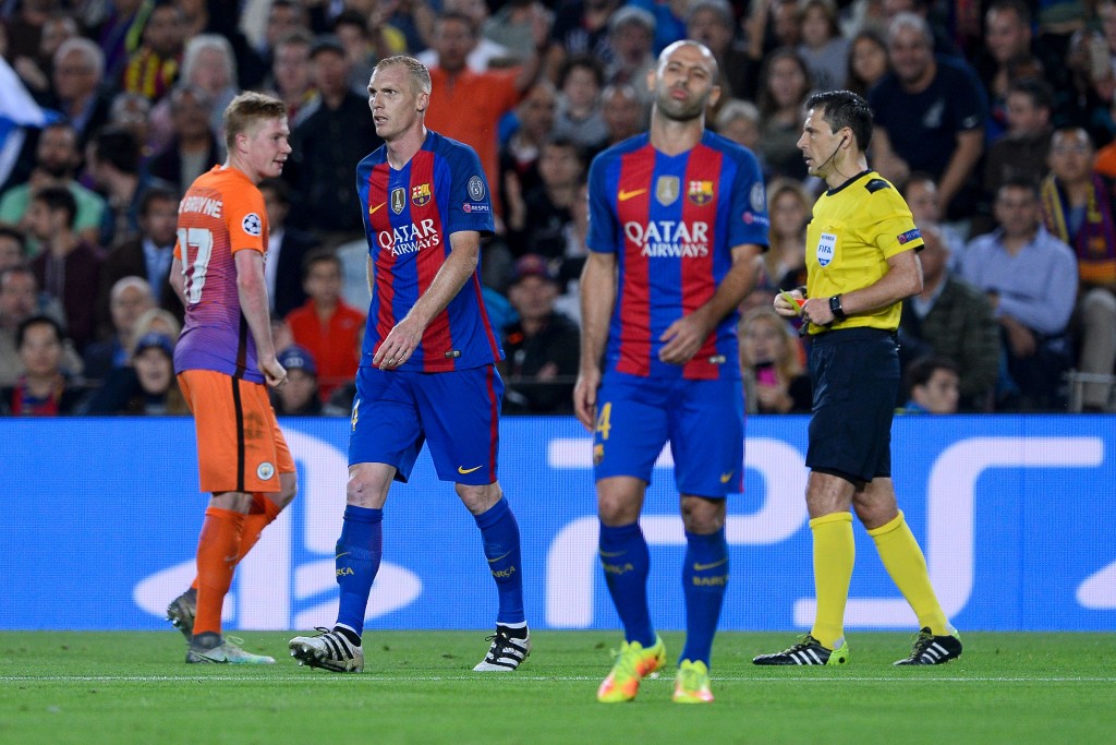 Barcelona's French defender Jeremy Mathieu (2nd L) leaves the pitch after being shown a red card during the UEFA Champions League football match FC Barcelona vs Manchester City at the Camp Nou stadium in Barcelona on October 19, 2016. (Photo by Josep Lago/AFP/Getty Images)