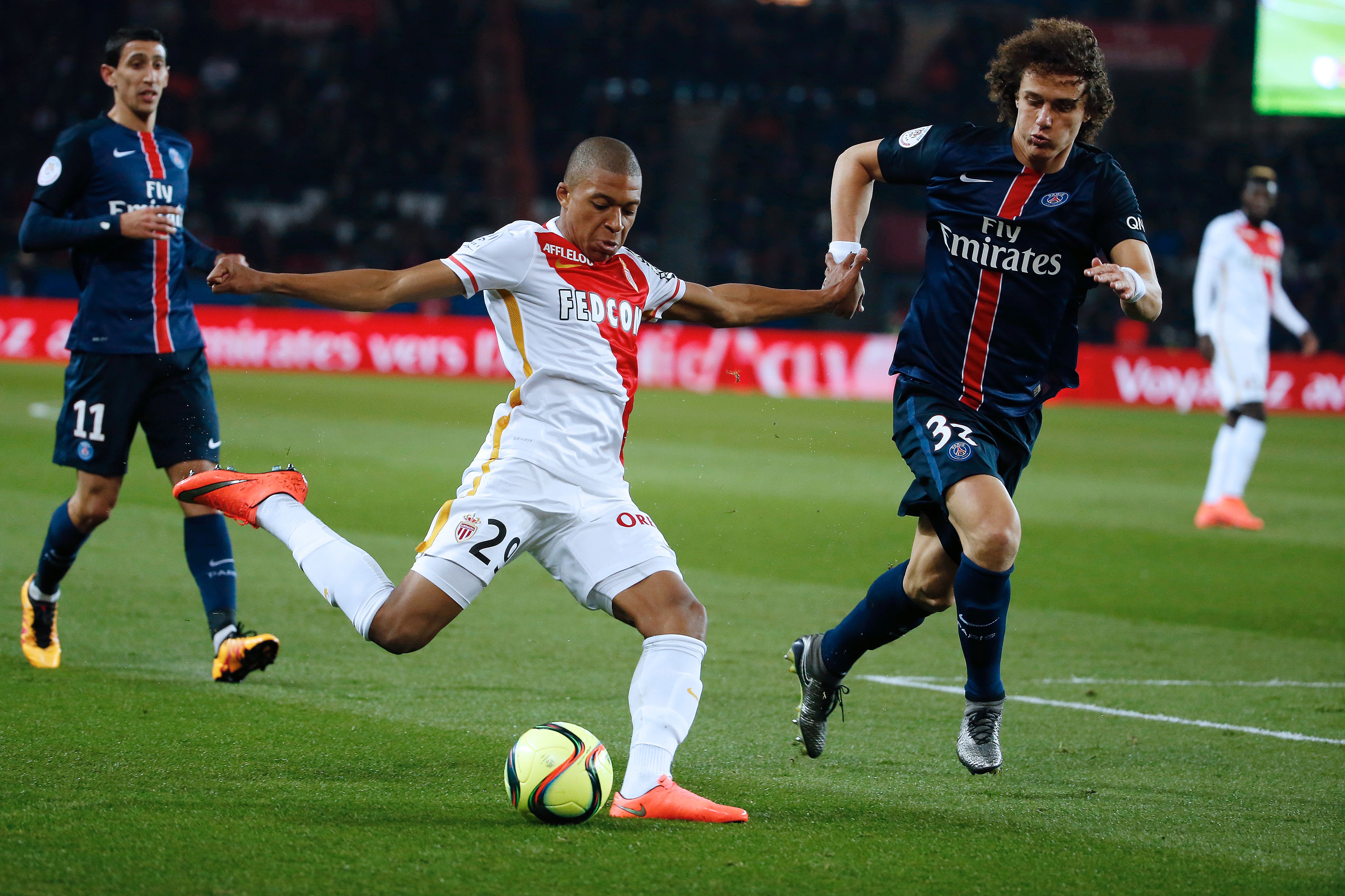 Monaco's French forward Kylian Mbappe Lottin (L) challenges Paris Saint-Germain's Brazilian defender David Luiz during the French L1 football match between Paris Saint-Germain and Monaco at the Parc des Princes stadium in Paris on March 20, 2016. AFP PHOTO / THOMAS SAMSON / AFP / THOMAS SAMSON (Photo credit should read THOMAS SAMSON/AFP/Getty Images)