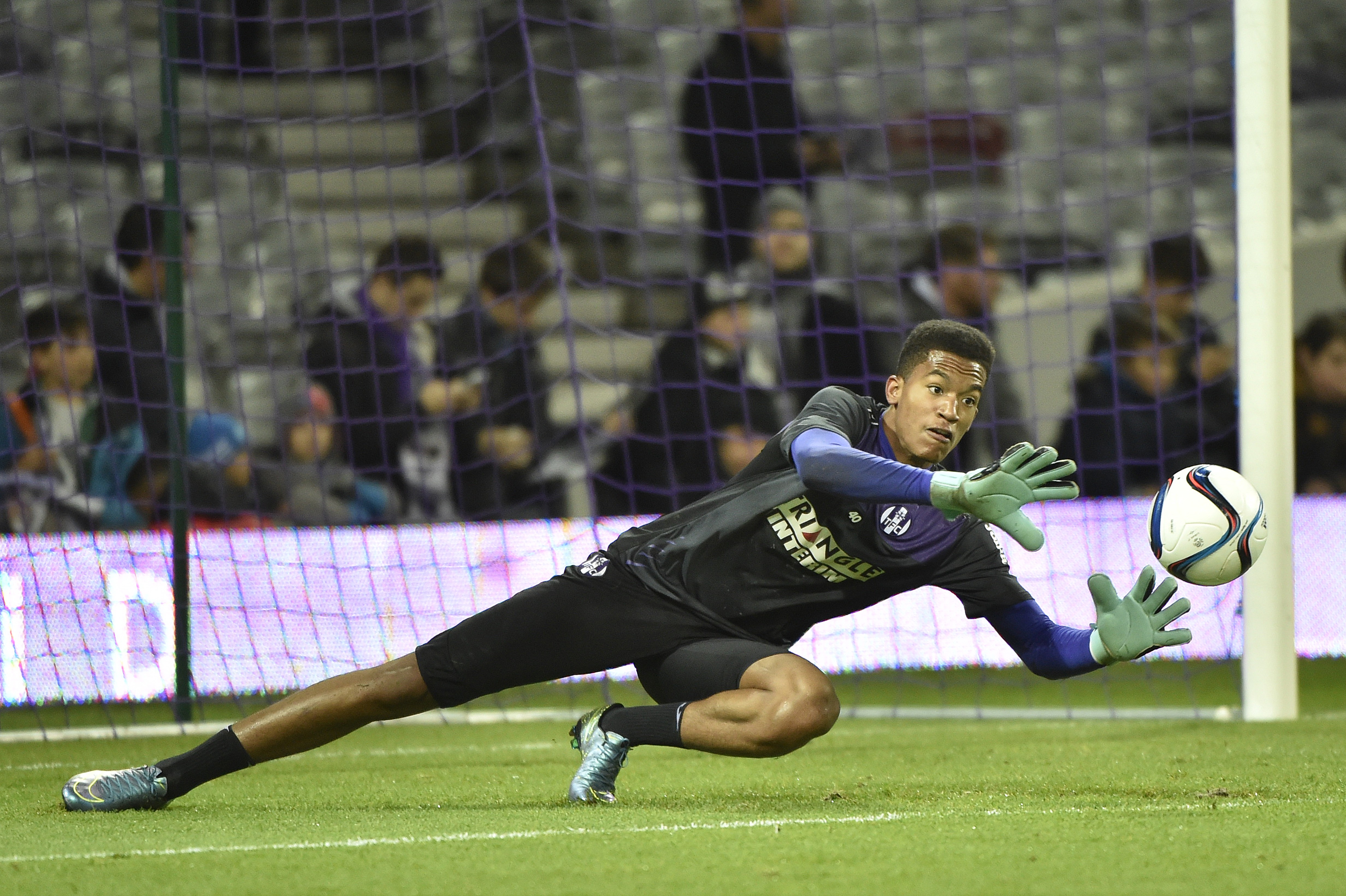 Toulouse's French goalkeeper Alban Lafont warms up before the French L1 football match Toulouse against Lorient on Ddecember 5, 2015 at the Municipal Stadium in Toulouse. AFP PHOTO / PASCAL PAVANI / AFP / PASCAL PAVANI (Photo credit should read PASCAL PAVANI/AFP/Getty Images)