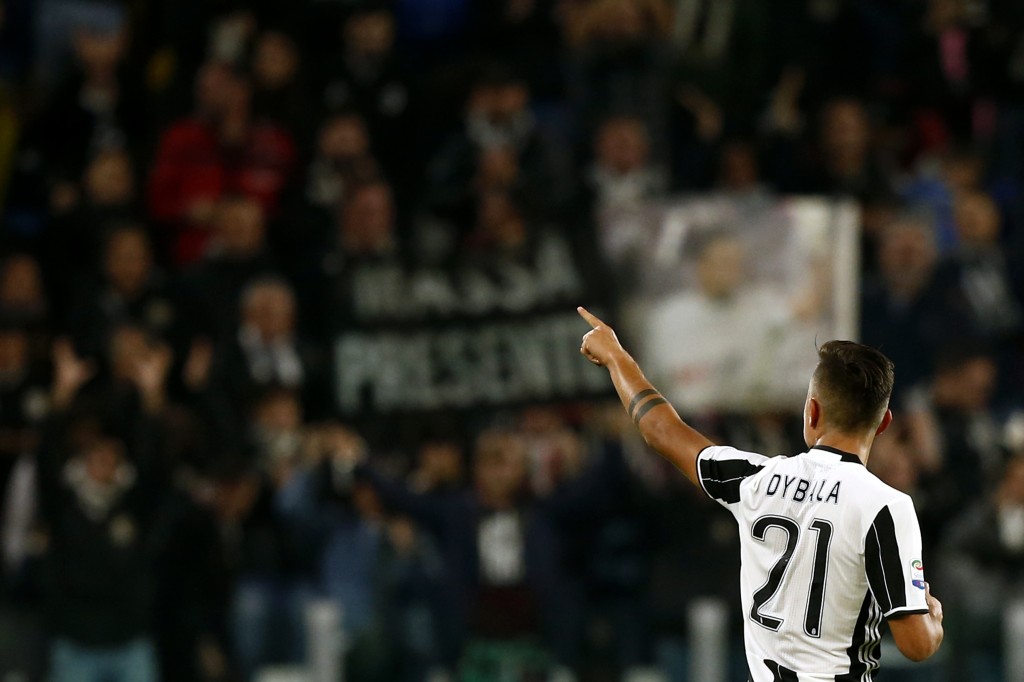 Juventus' forward Paulo Dybala from Argentina celebrates after scoring during the Italian Serie A football match Juventus vs Udinese on October 15, 2016 at the 'Juventus Stadium' in Turin. / AFP / MARCO BERTORELLO (Photo credit should read MARCO BERTORELLO/AFP/Getty Images)