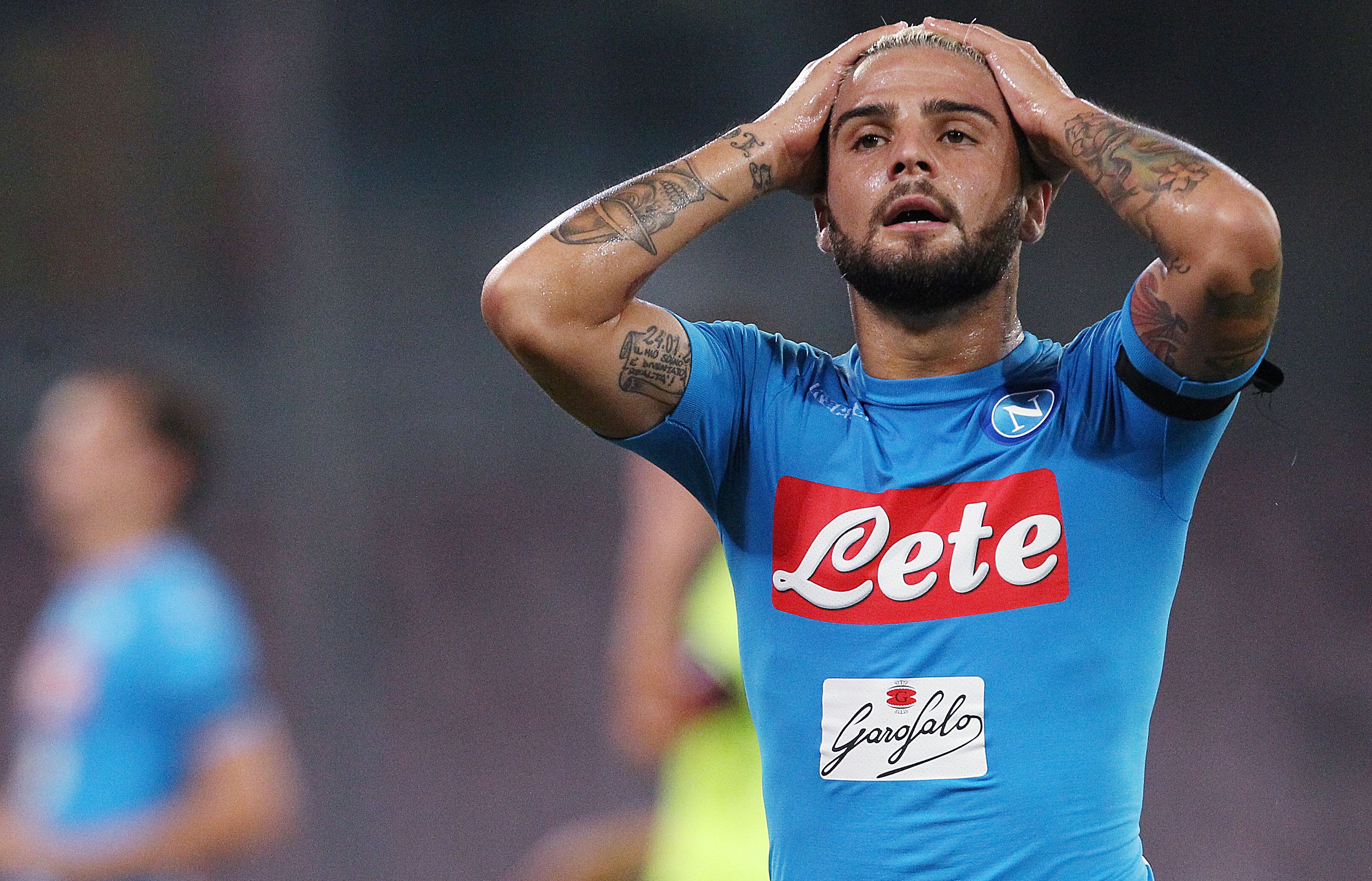 Napoli's Italian forward Lorenzo Insigne reacts after missing a goal during the Italian Serie A football match SSC Napoli vs Bologna FC on September 17 2016 at the San Paolo stadium in Naples. / AFP / CARLO HERMANN (Photo credit should read CARLO HERMANN/AFP/Getty Images)