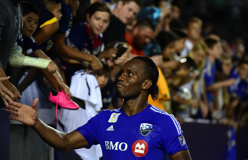 Didier Drogba of the Montreal Impact meets with fans following a 0-0 draw with the LA Galaxy in their MLS match on September 12, 2015 in Carson, California. AFP PHOTO /FREDERIC J.BROWN (Photo credit should read FREDERIC J. BROWN/AFP/Getty Images)