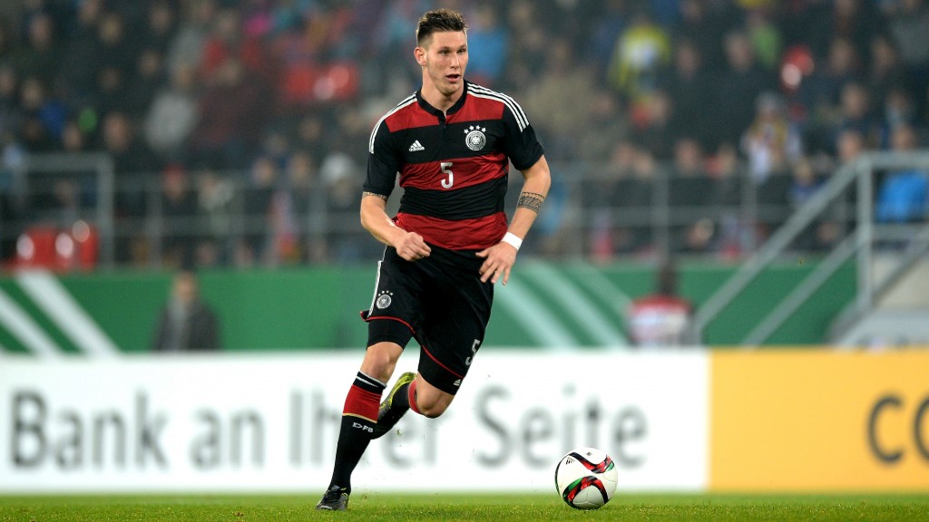 REGENSBURG, GERMANY - NOVEMBER 13: Niklas Suele of Germany runs with the ball during the 2017 UEFA European U21 Championships Qualifier between U21 Germany and U21 Azerbaijan at Continental Arena on November 13, 2015 in Regensburg, Germany. (Photo by Micha Will/Bongarts/Getty Images)