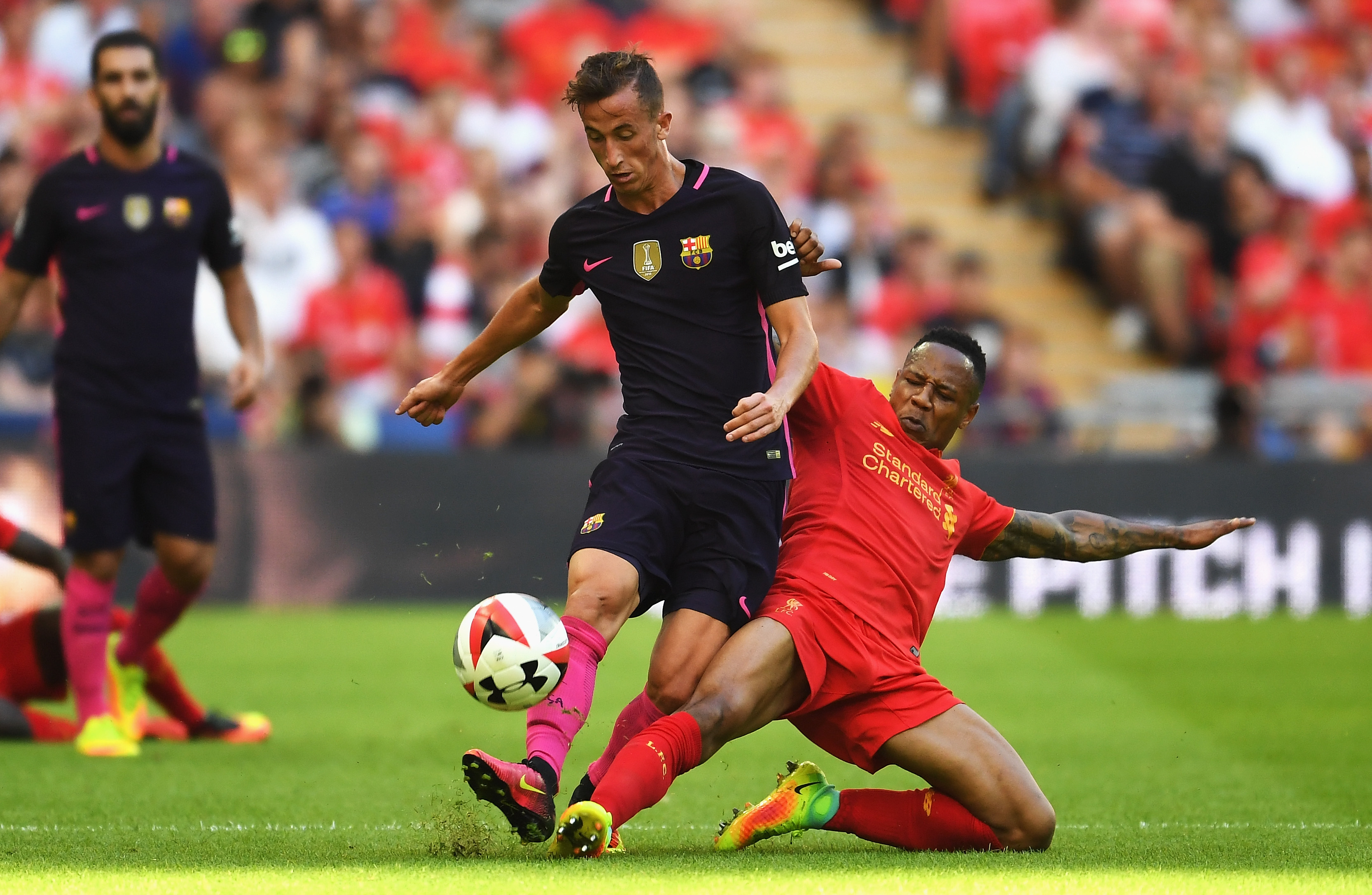 LONDON, ENGLAND - AUGUST 06: Nathaniel Clyne of Liverpool tackles Juan Camara of Barcelona during the International Champions Cup match between Liverpool and Barcelona at Wembley Stadium on August 6, 2016 in London, England. (Photo by Mike Hewitt/Getty Images)